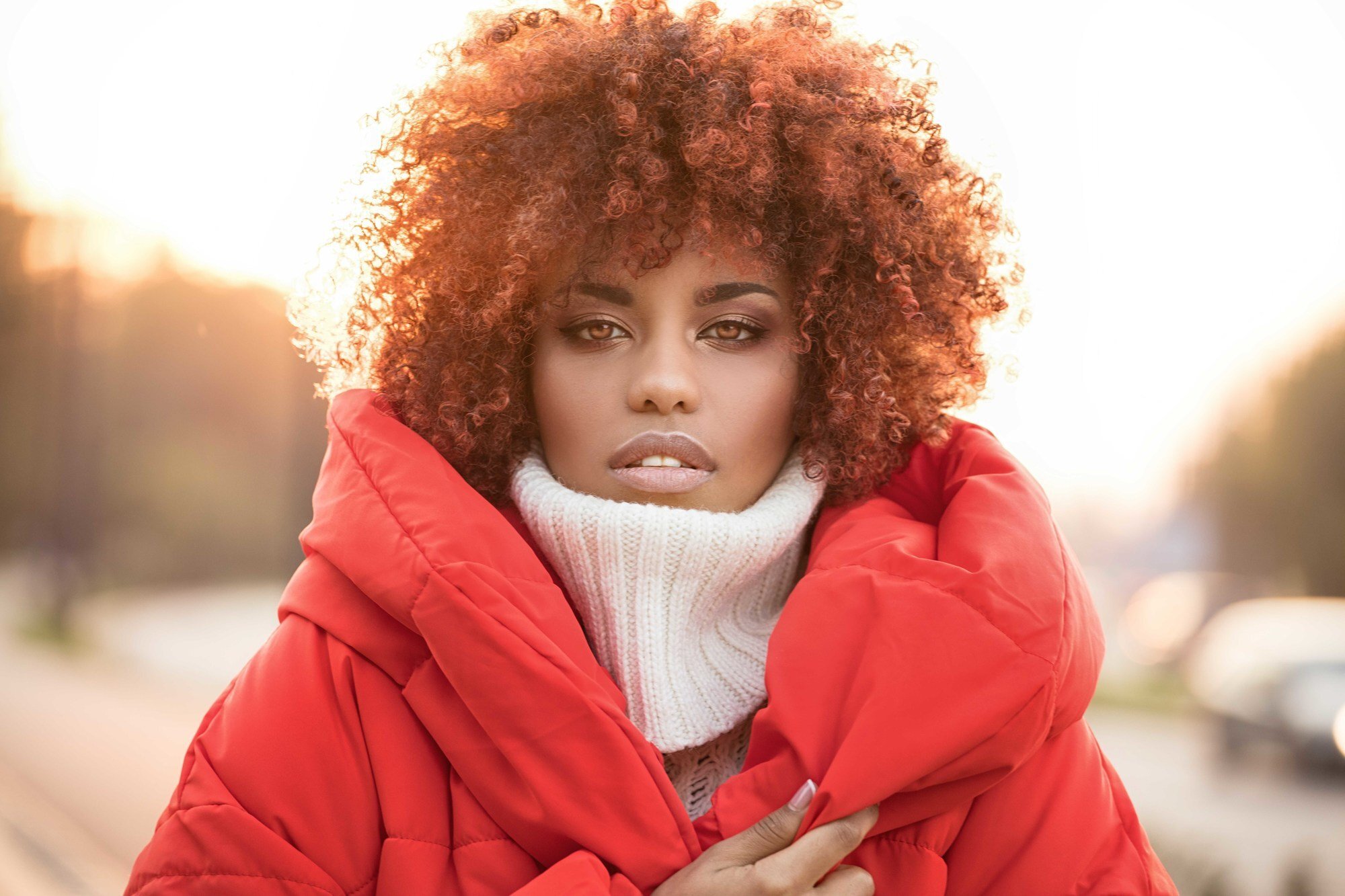 woman with curly hair copper shade