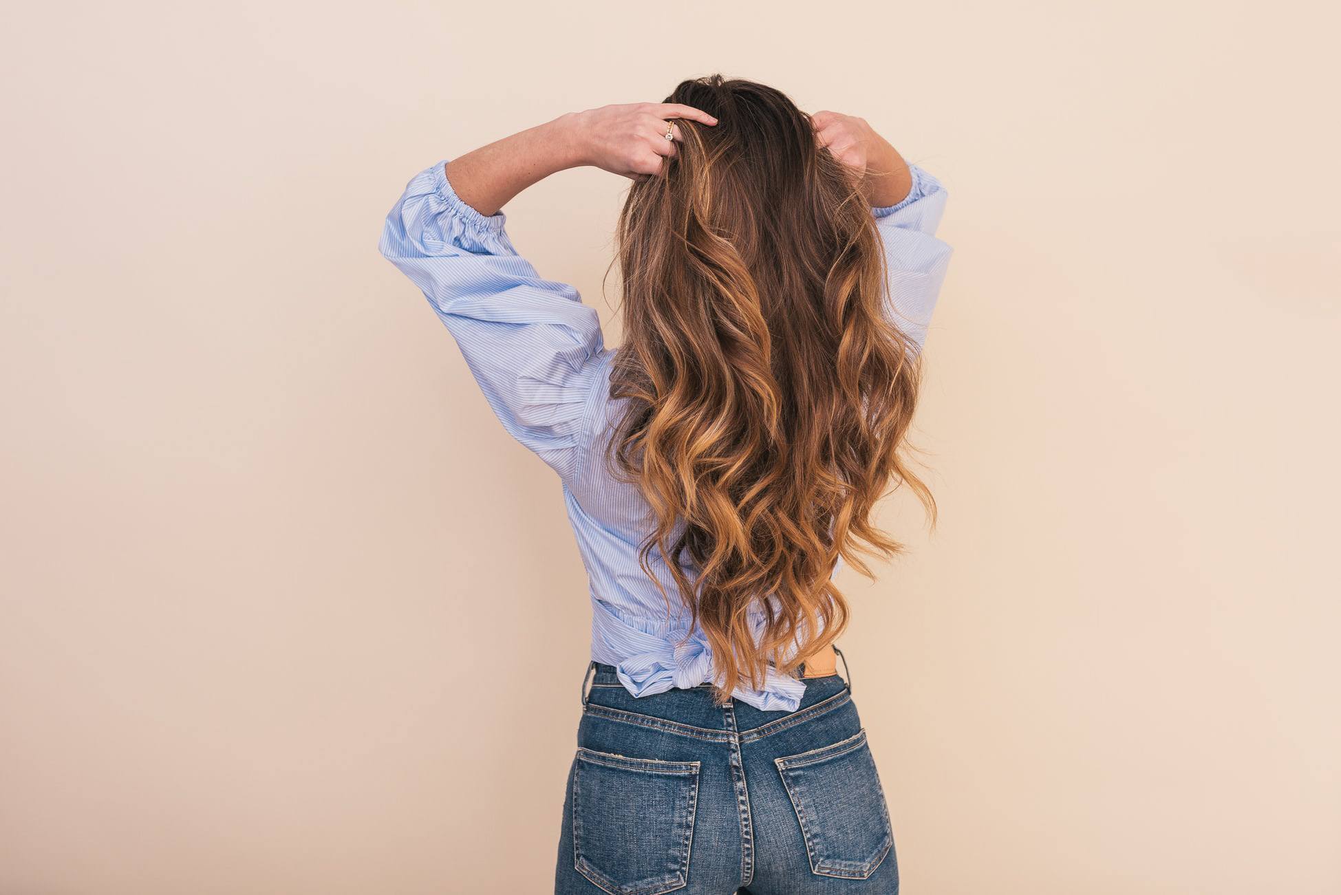 damage caused by styling woman with long layered hair