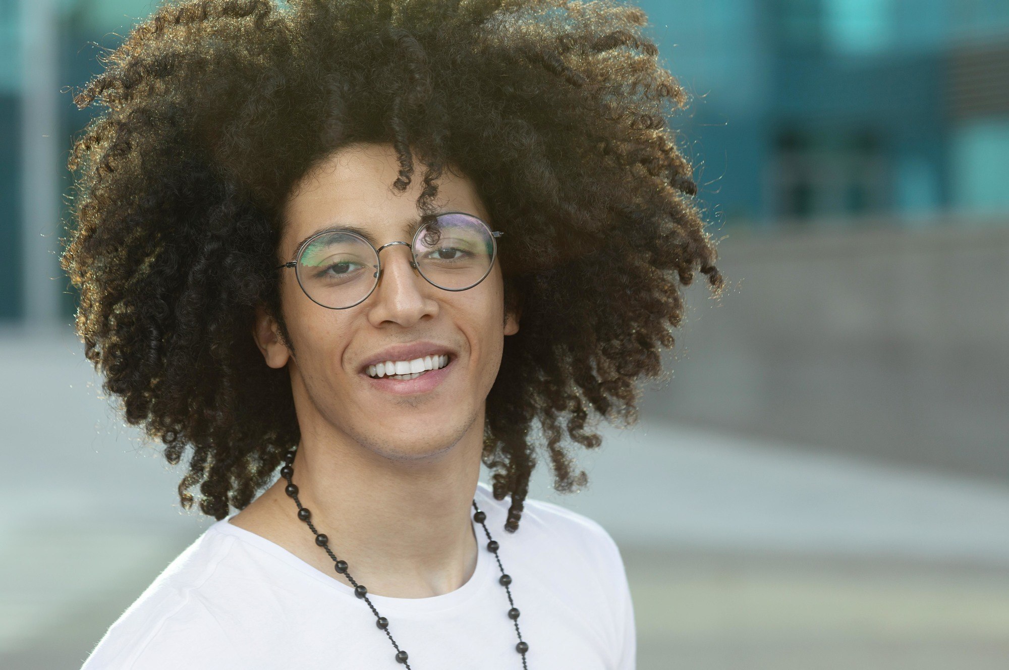 Man with big afro curls as a curly hairstyle for men