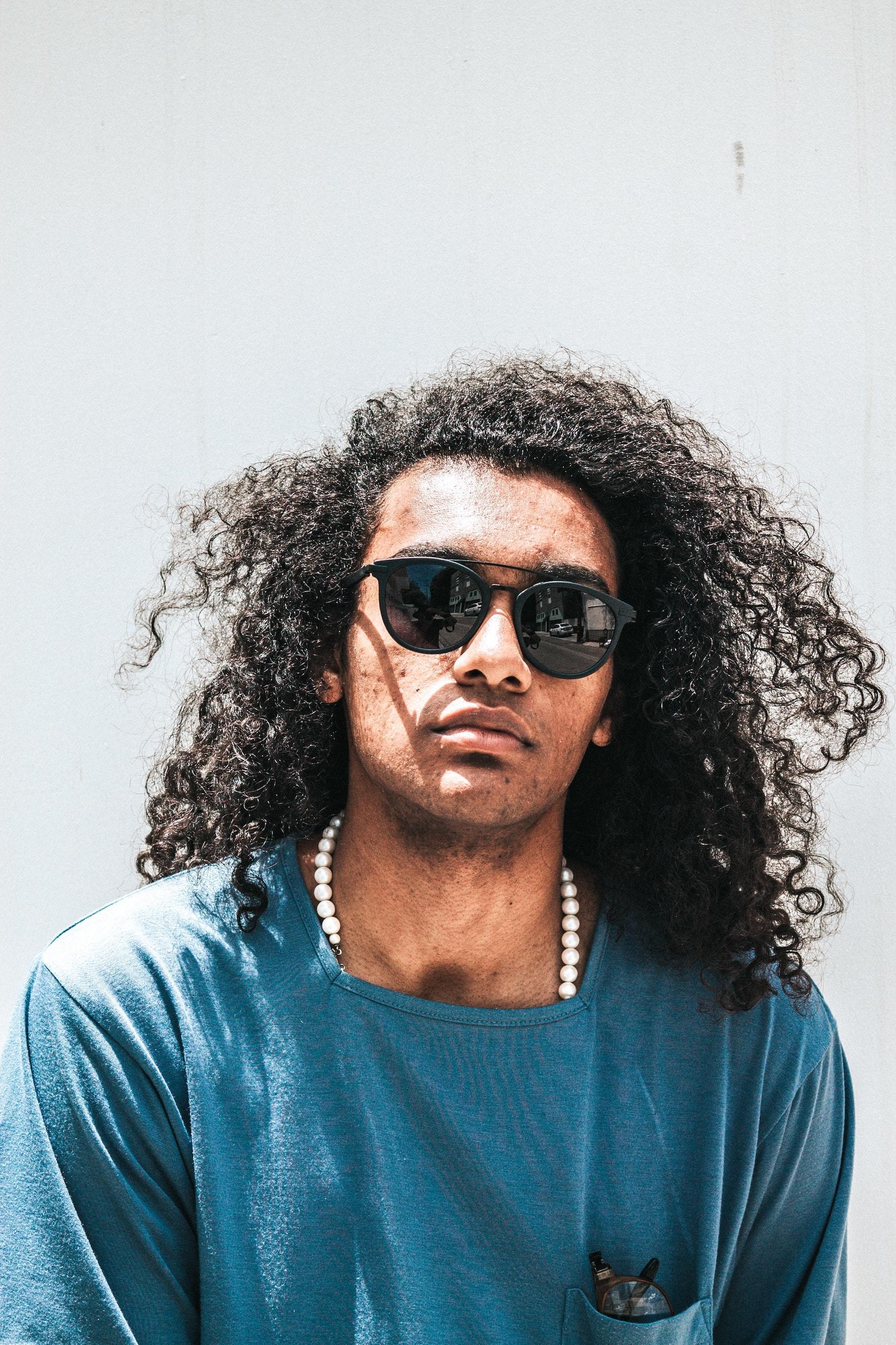 Man with long curly hair
