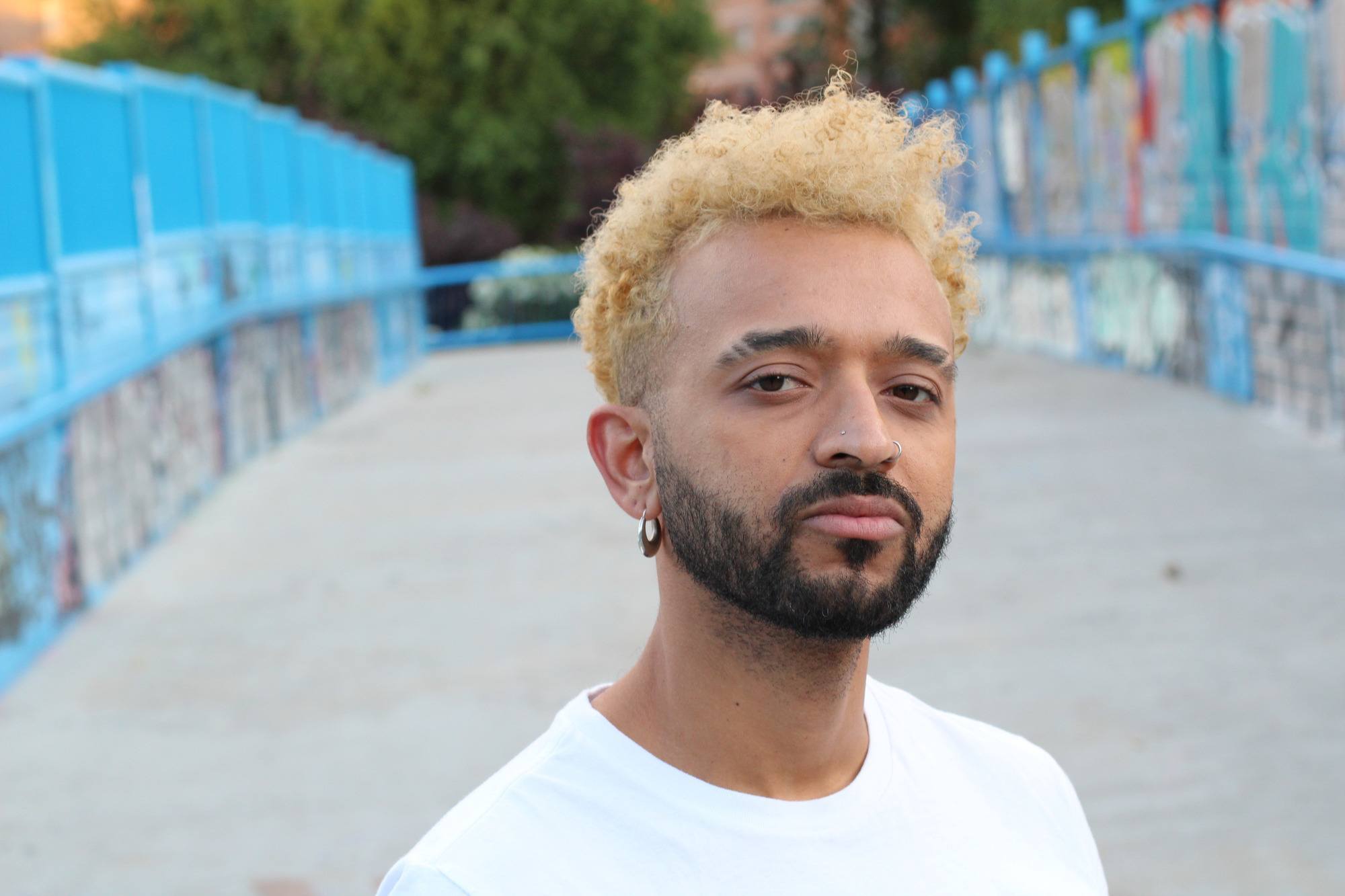 Man with short blonde dyed hair