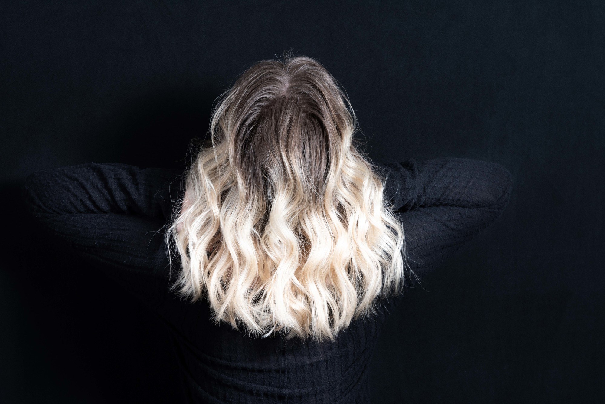 Ash blonde hair with dark roots
