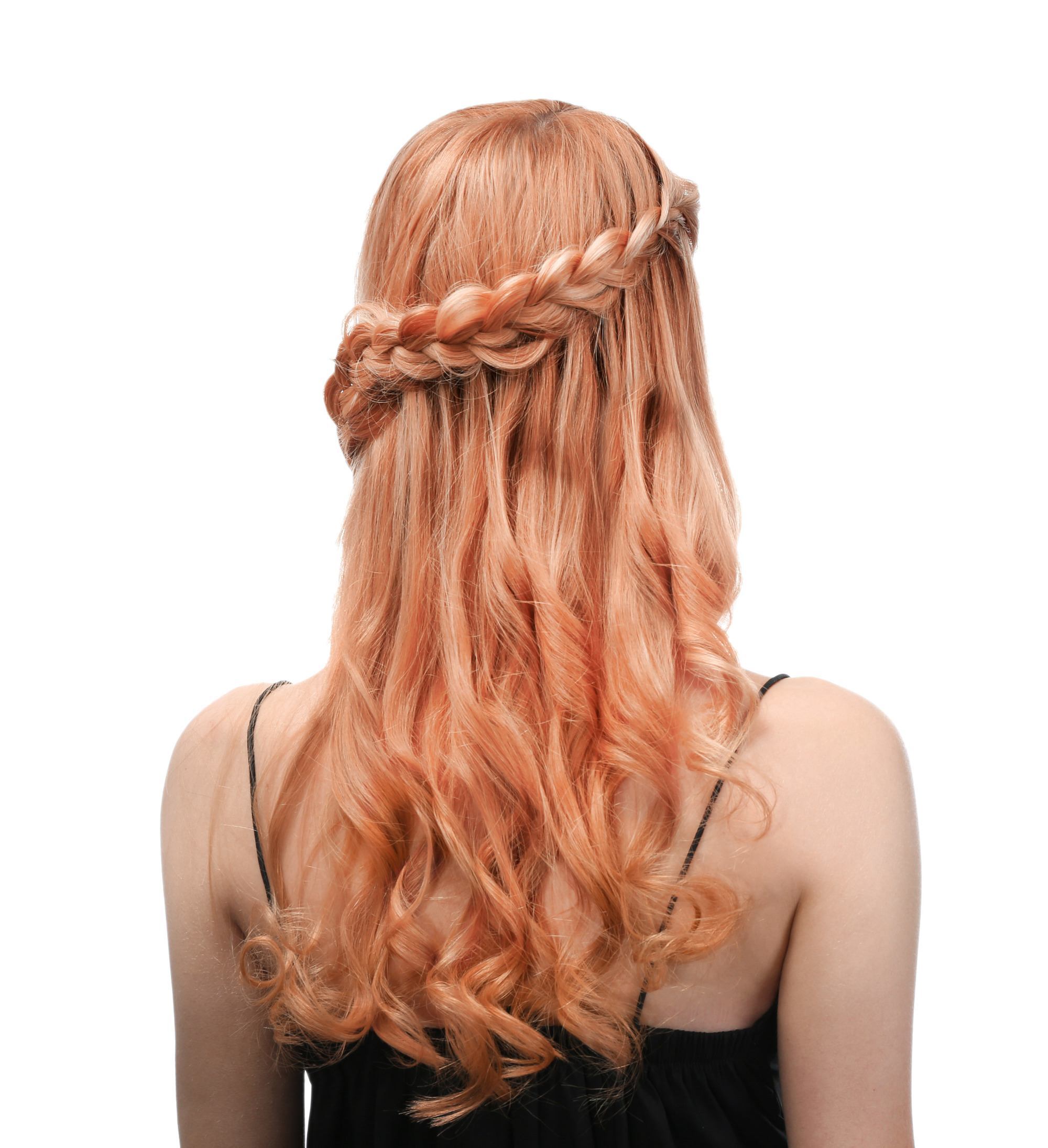 woman with long wavy hair and a braid