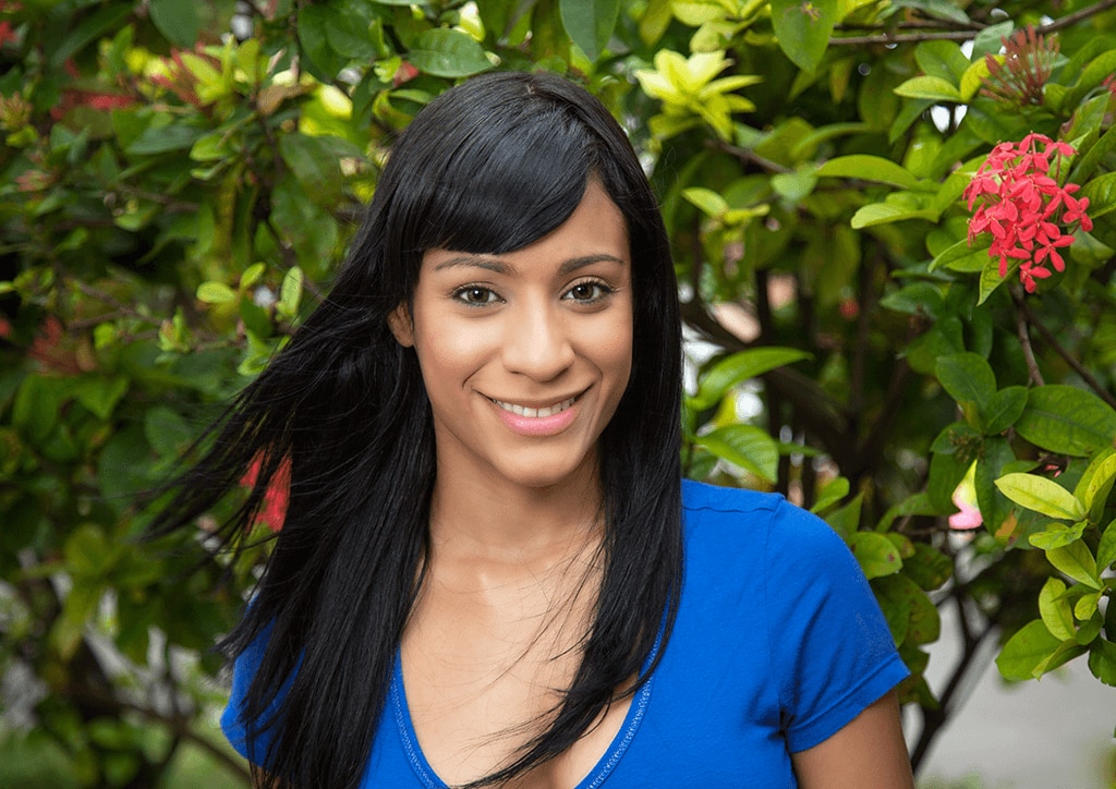 woman with long straight black hair with a fringe