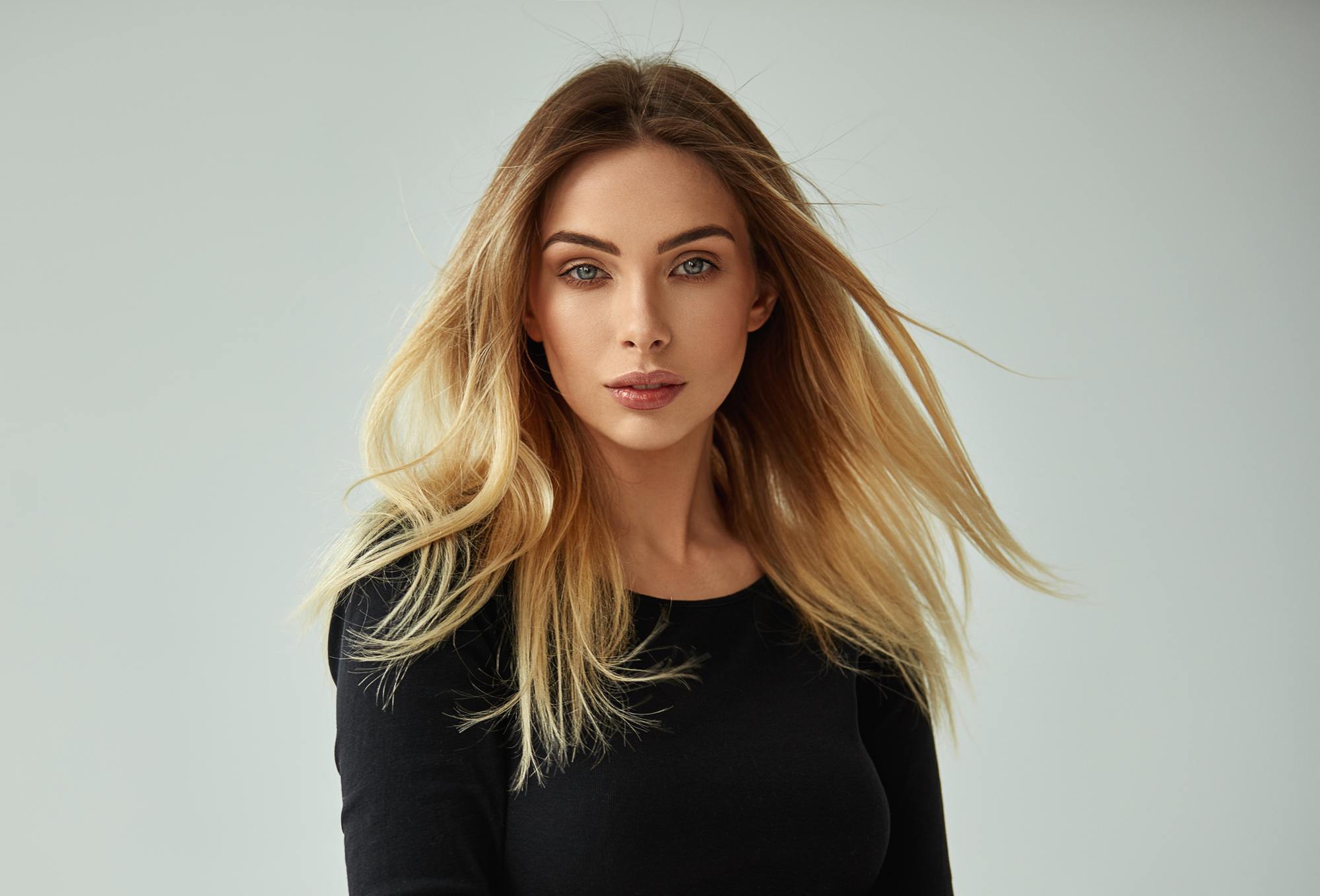 woman with medium length, straight golden brown hair