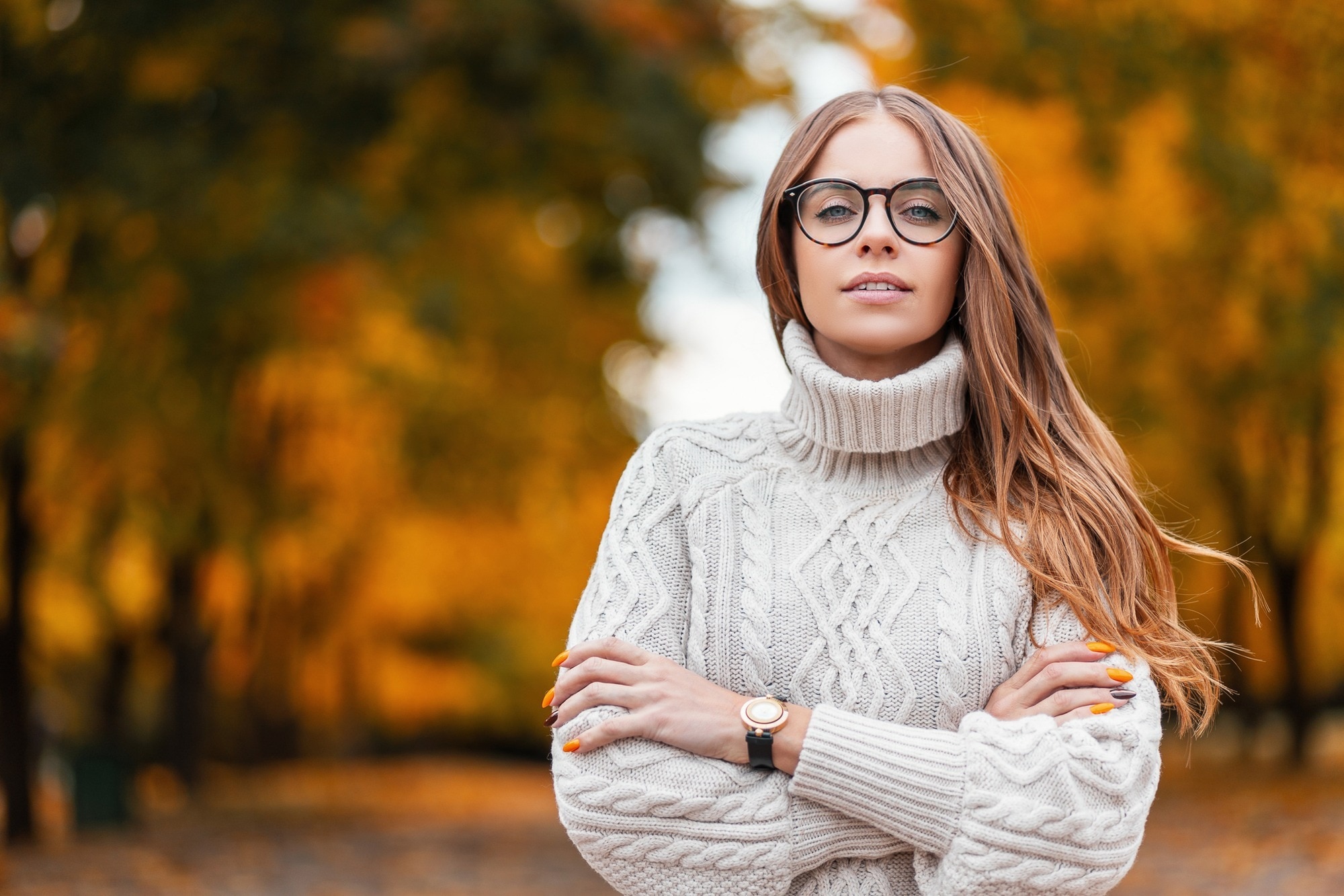 woman with long brown hair styled in a centre part