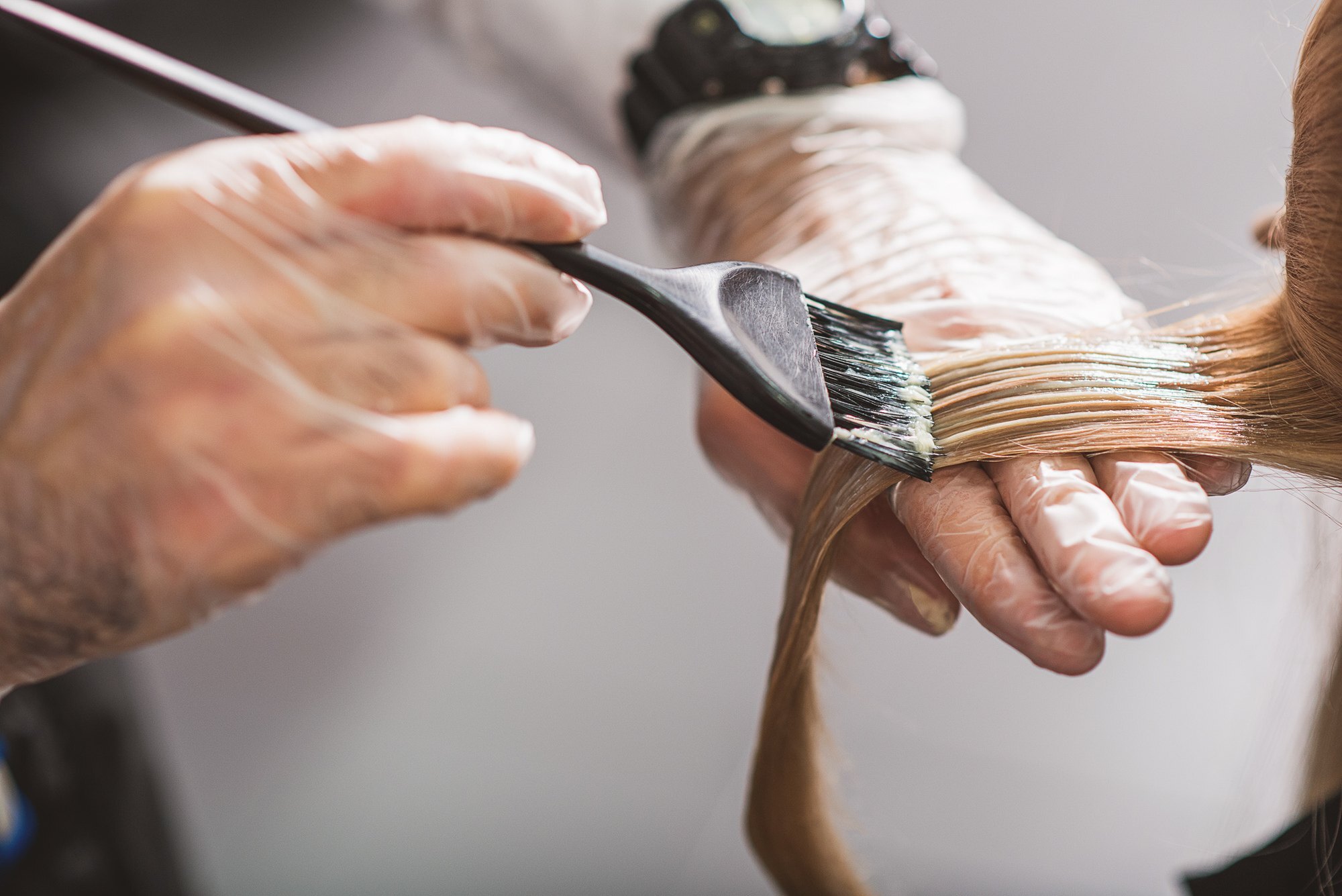 closeup of dyeing hair with brush