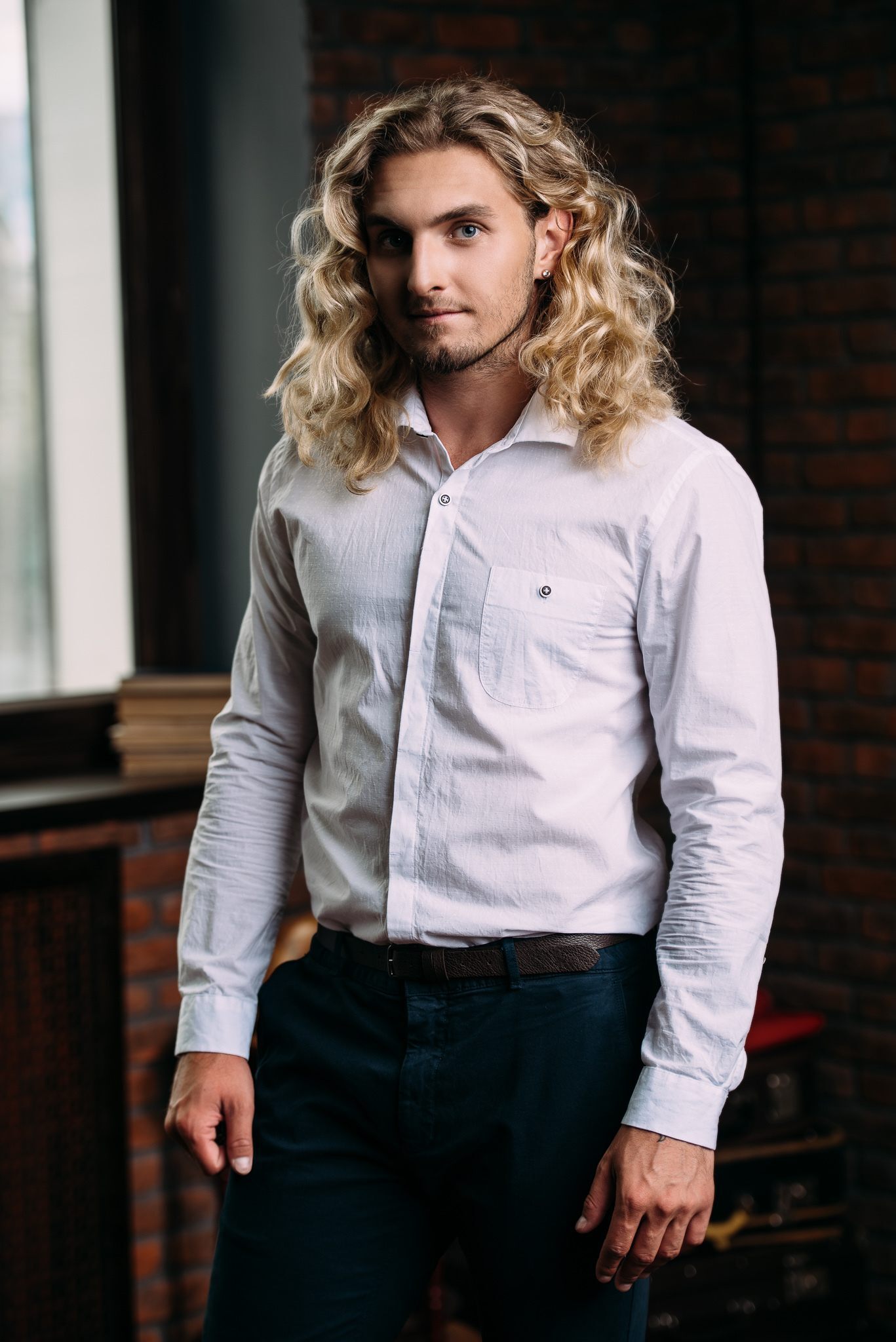 man with long blonde curly hair
