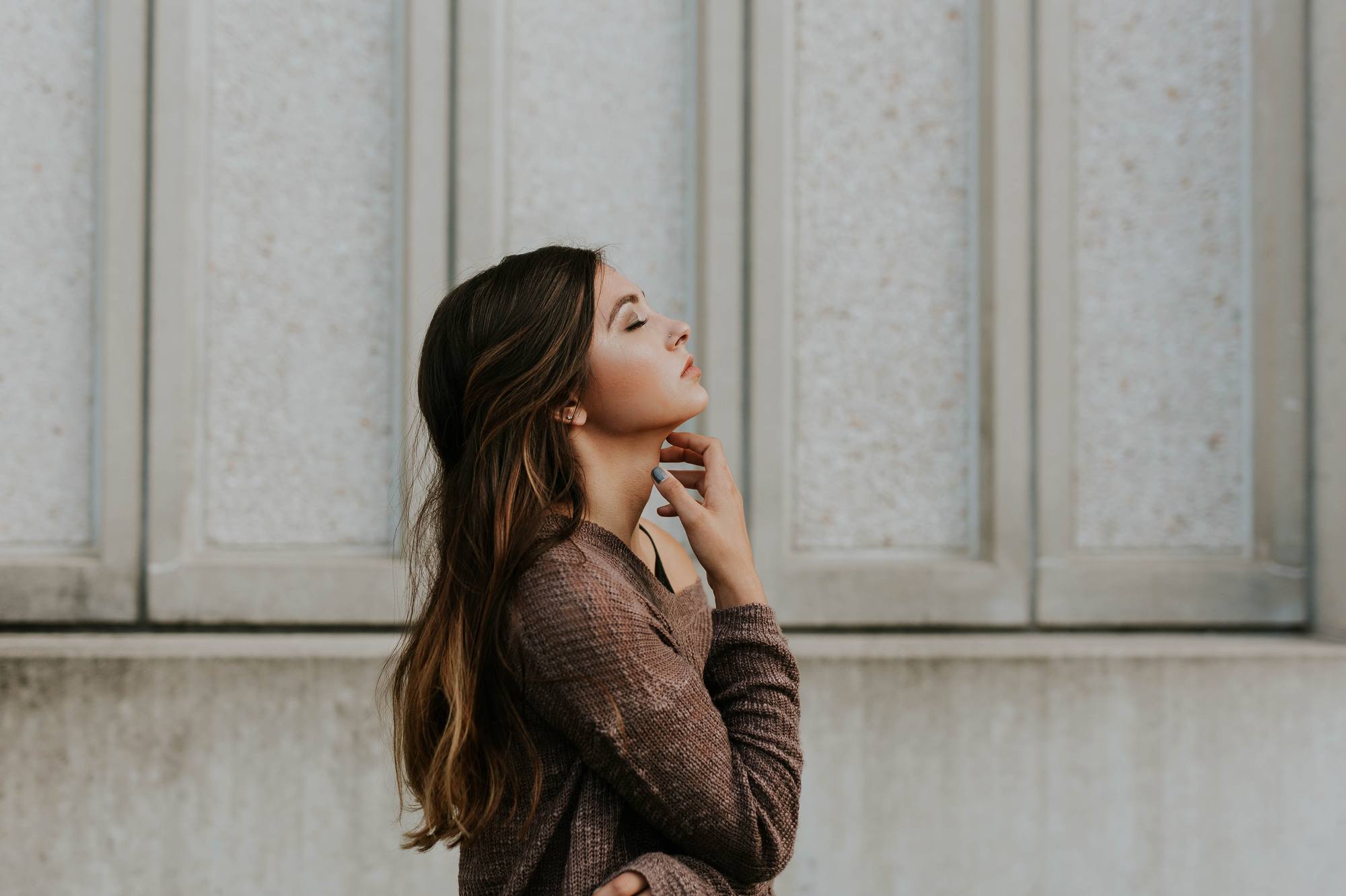 woman with long dark brown hair with medium brown hightlights