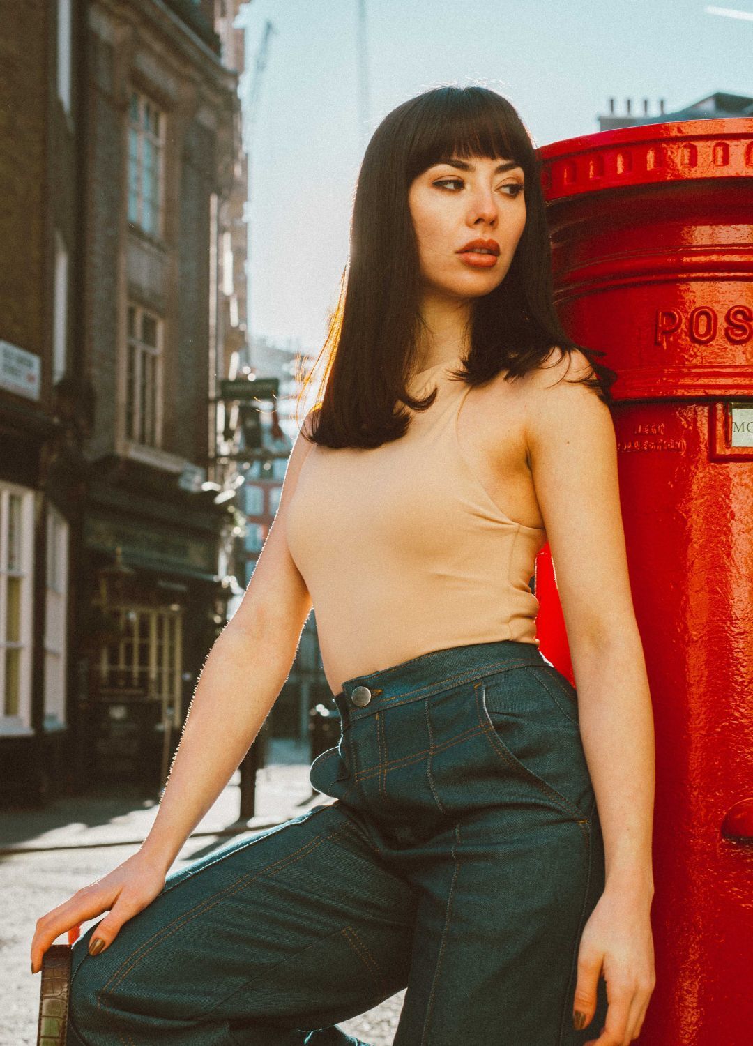Cancer zodiac: woman with blunt-cut shoulder-length hair with a full, blunt fringe