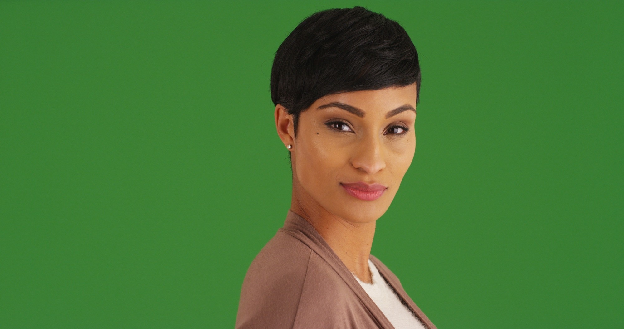 gemini hairstyles: woman with a sleek short pixie style haircut with a fringe
