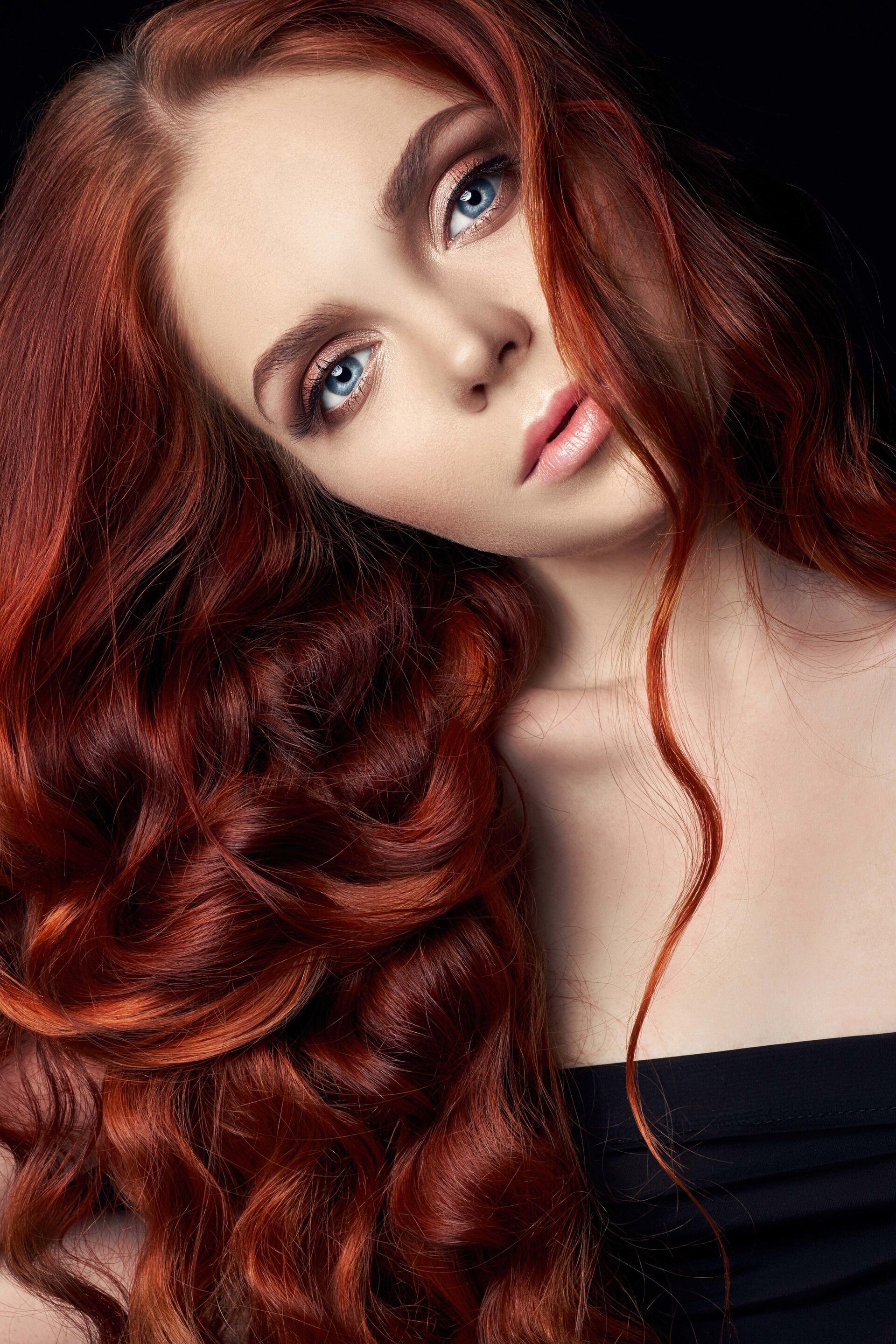 woman with dark red waves