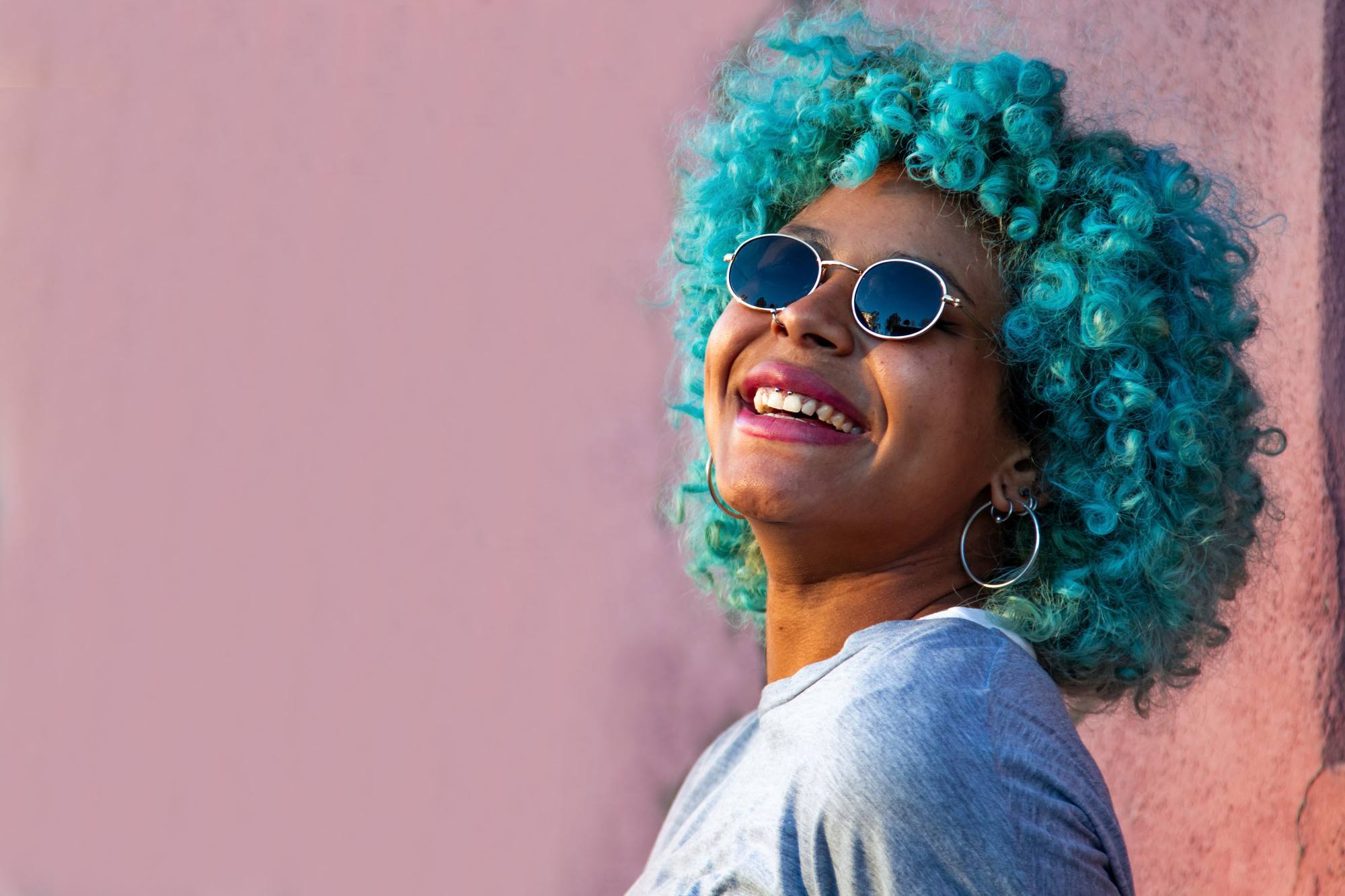 birthstone-inspired hair colour: woman with bright turquoise hair