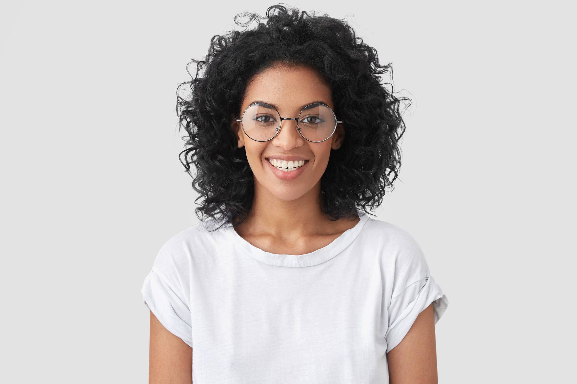 woman with neck-length naturally curly hair