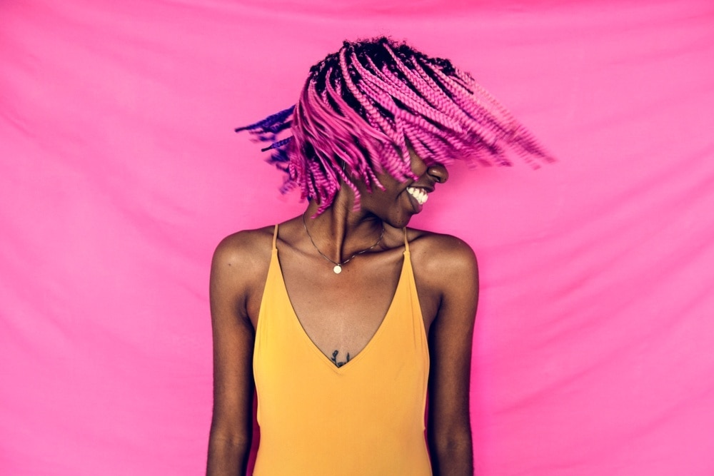 Woman with bright pink braids