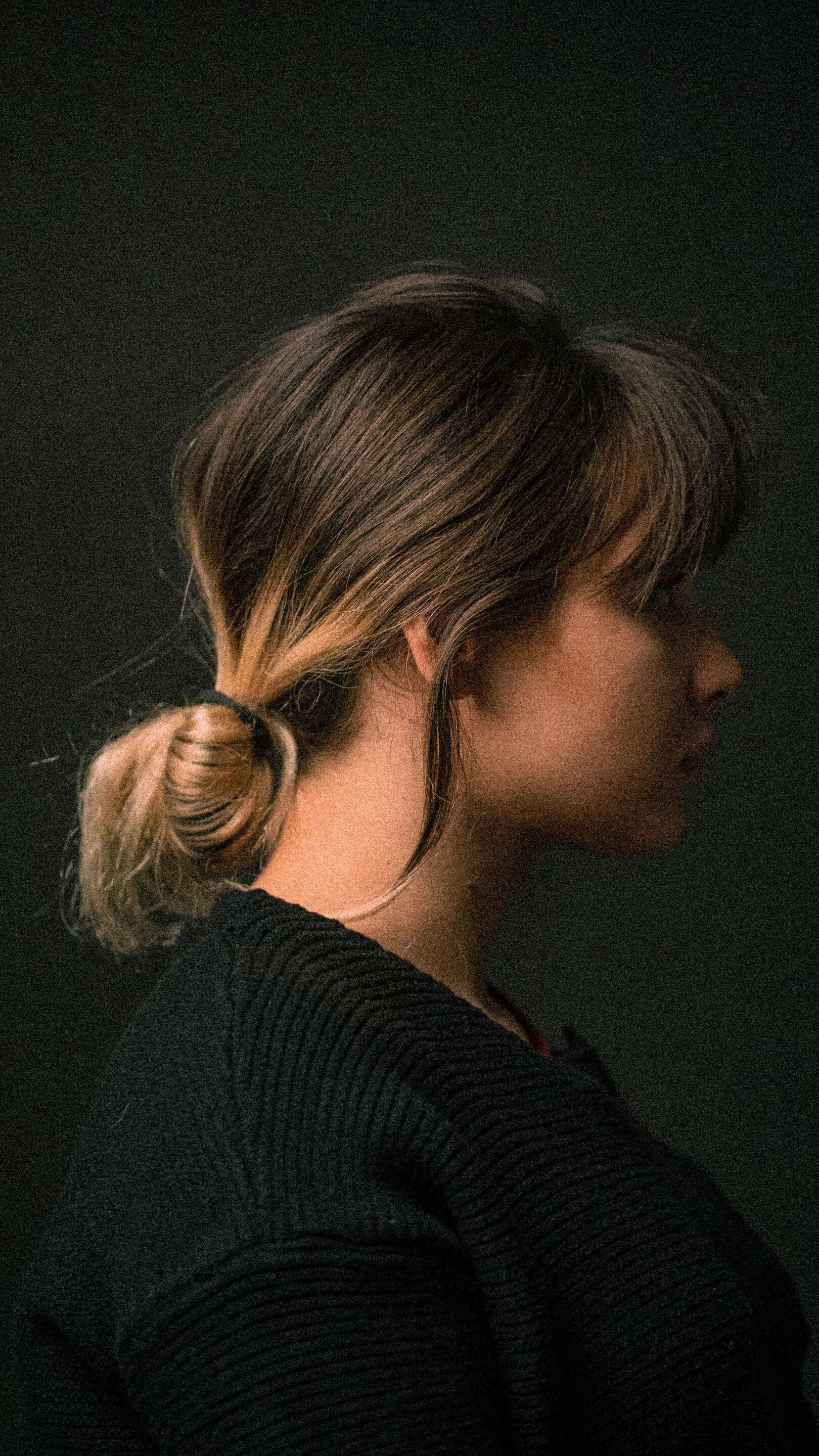 Woman wearing a low looped ponytail