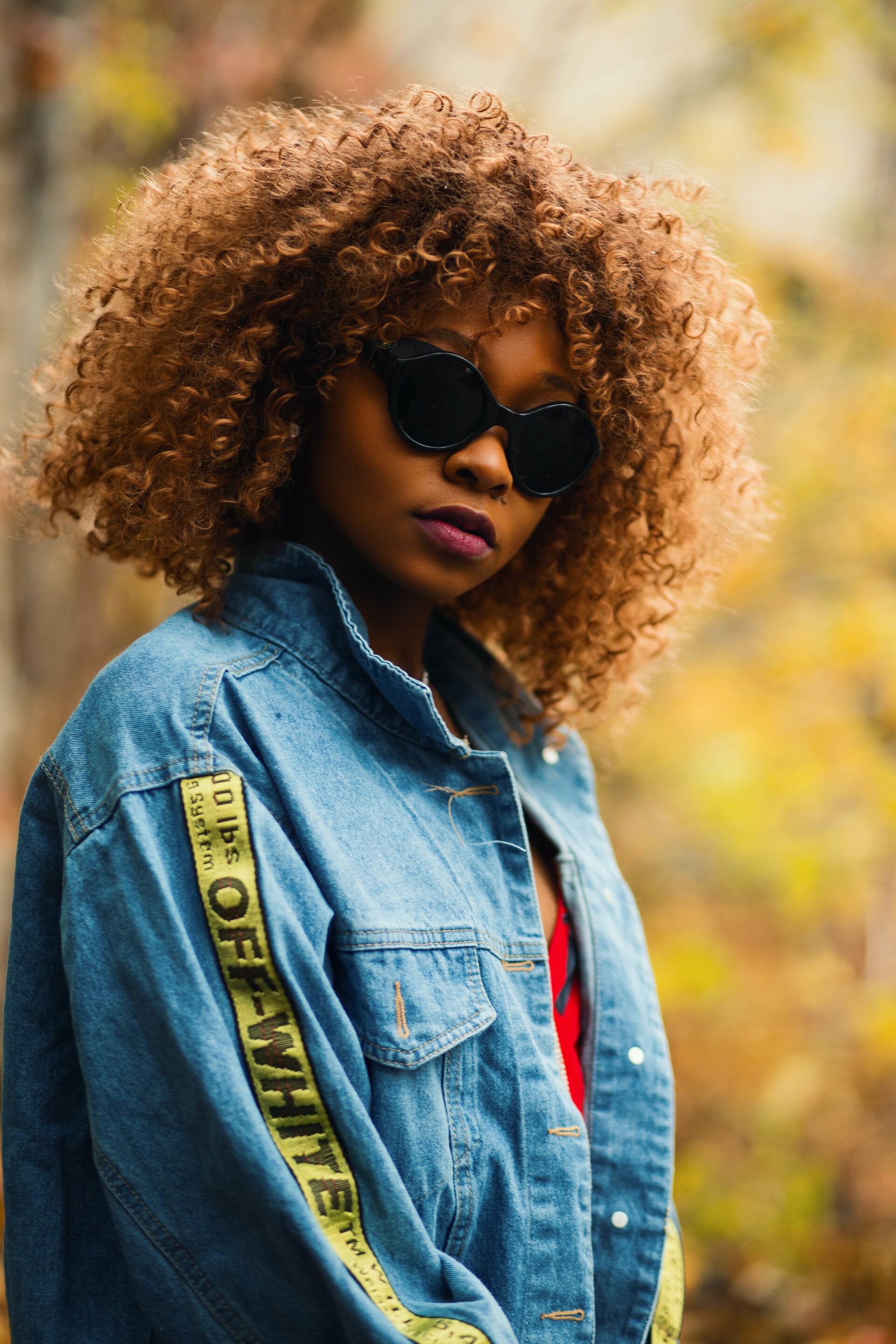 woman with honey coloured curly hair