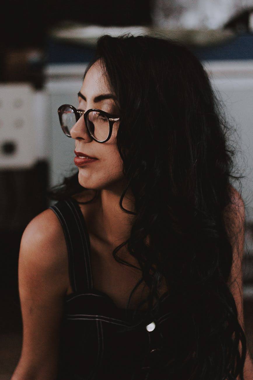 woman with dark hair black hair curly