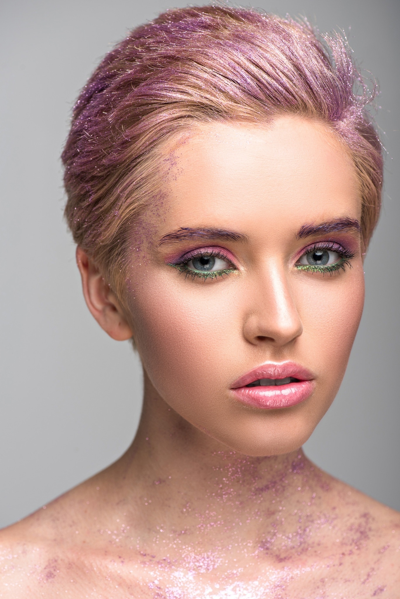 woman with pixie cut hair purple hair glitter