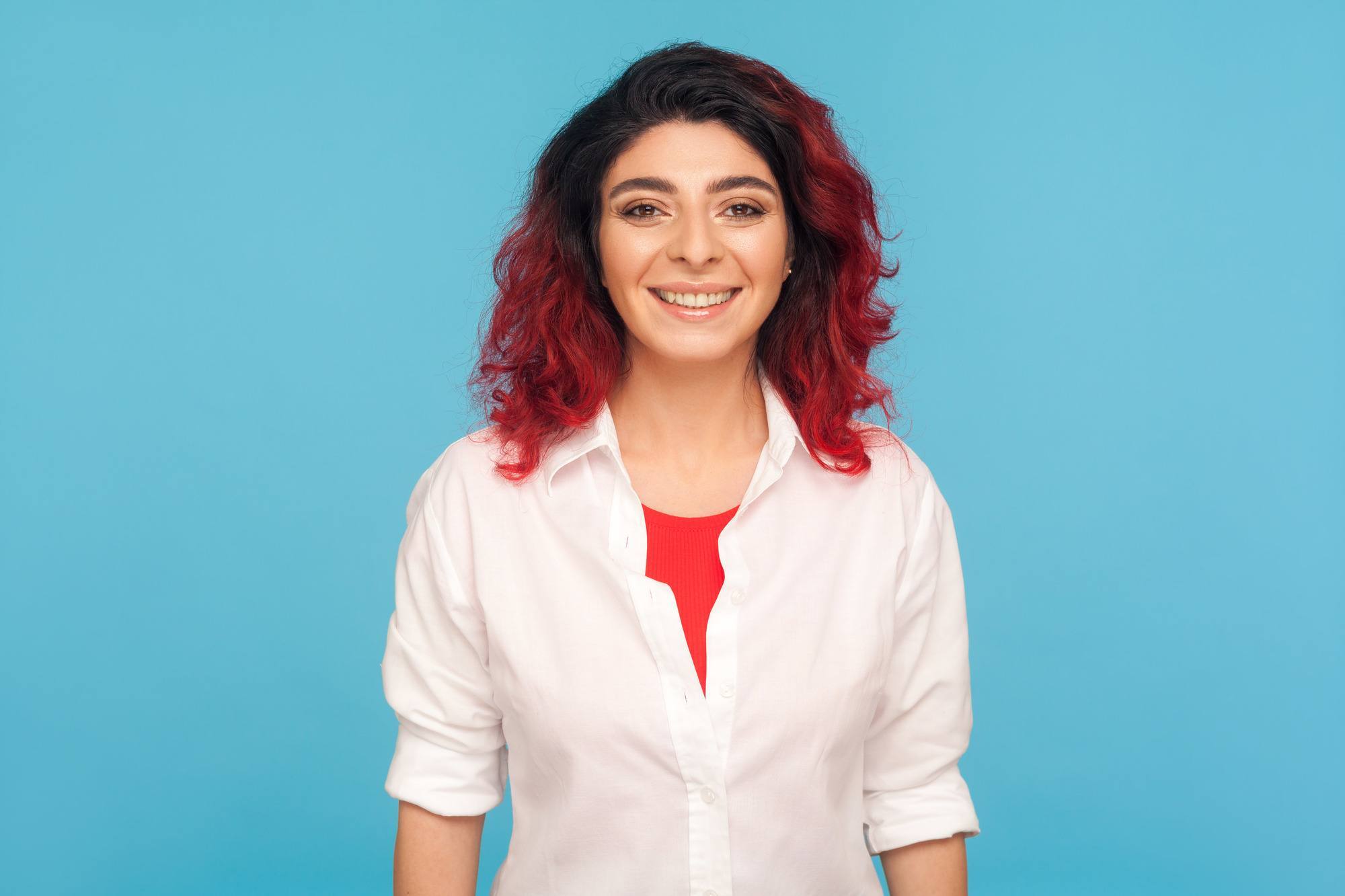 black and red hair: woman with black roots and bright red lengths
