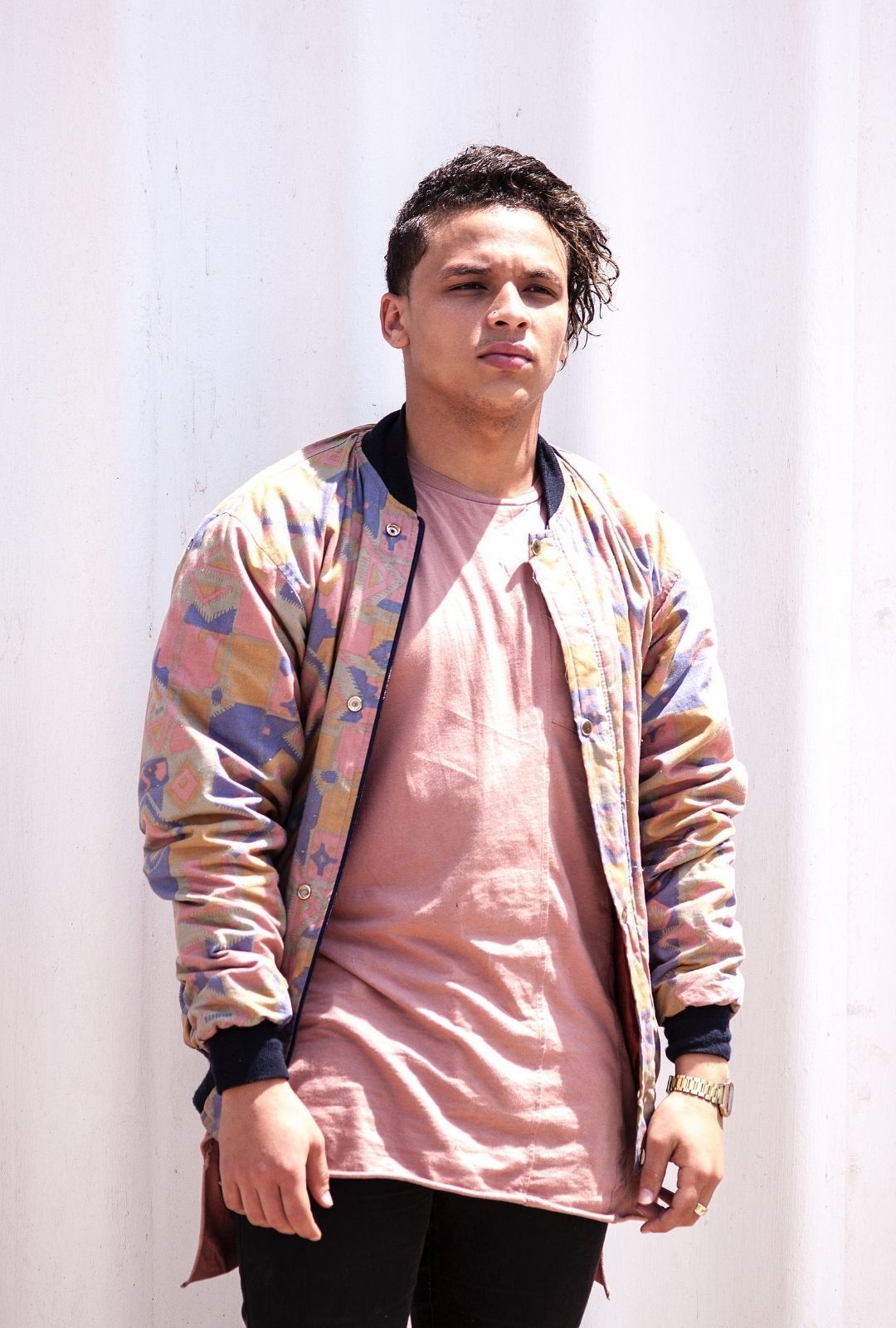 men with round faces: man with an undercut and medium-length wavy hair