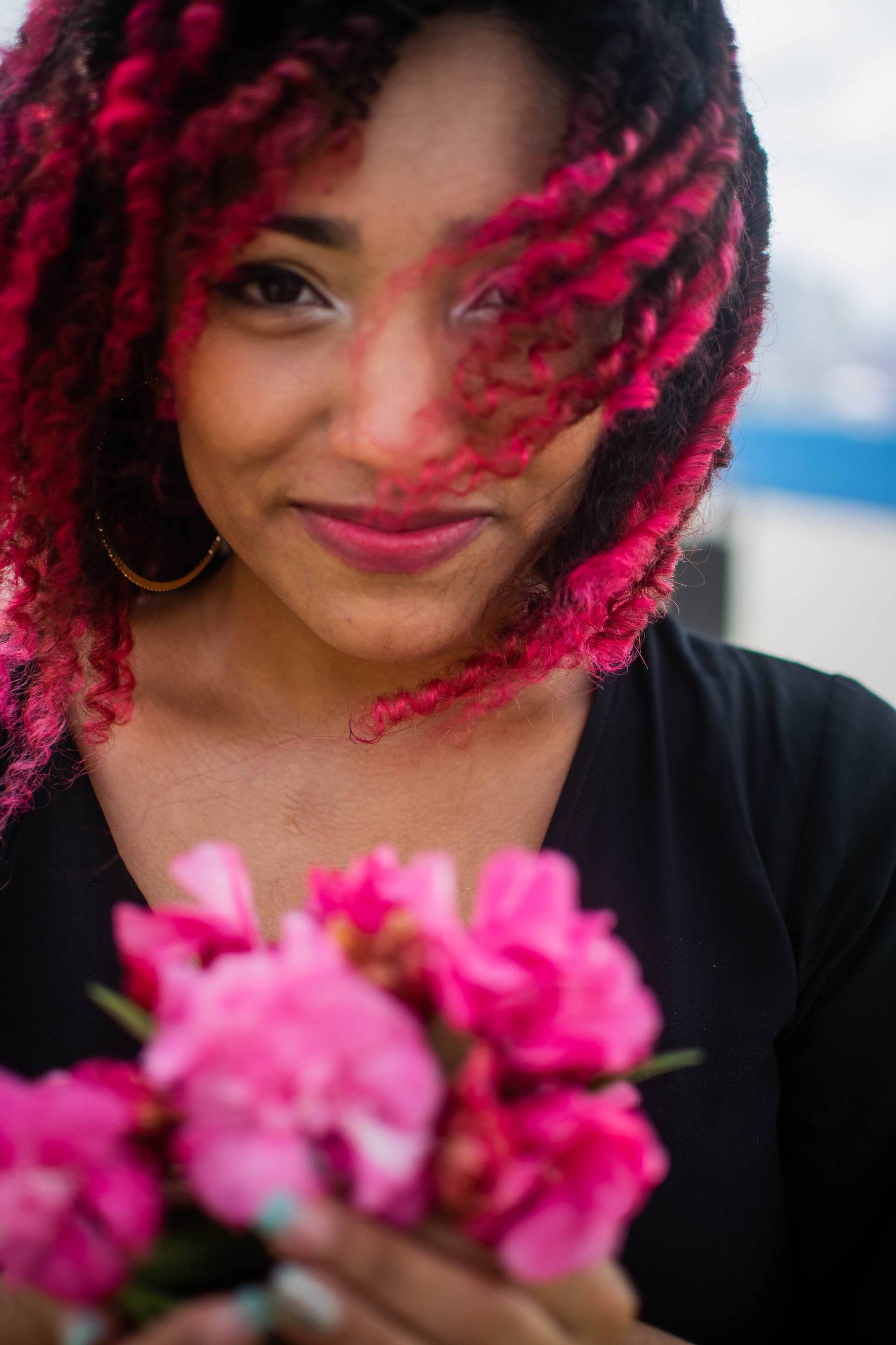 woman with bright pink dip dye hair