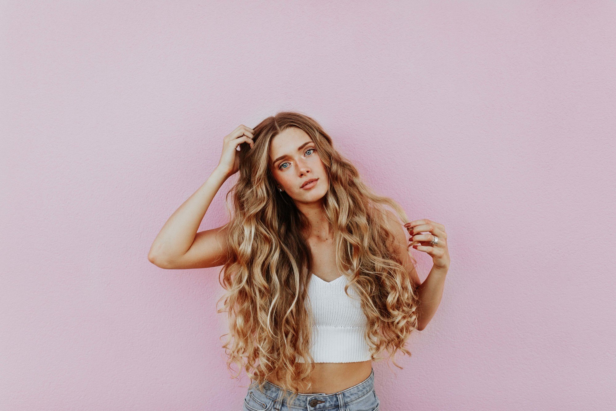 woman with very long wavy hair and golden highlights