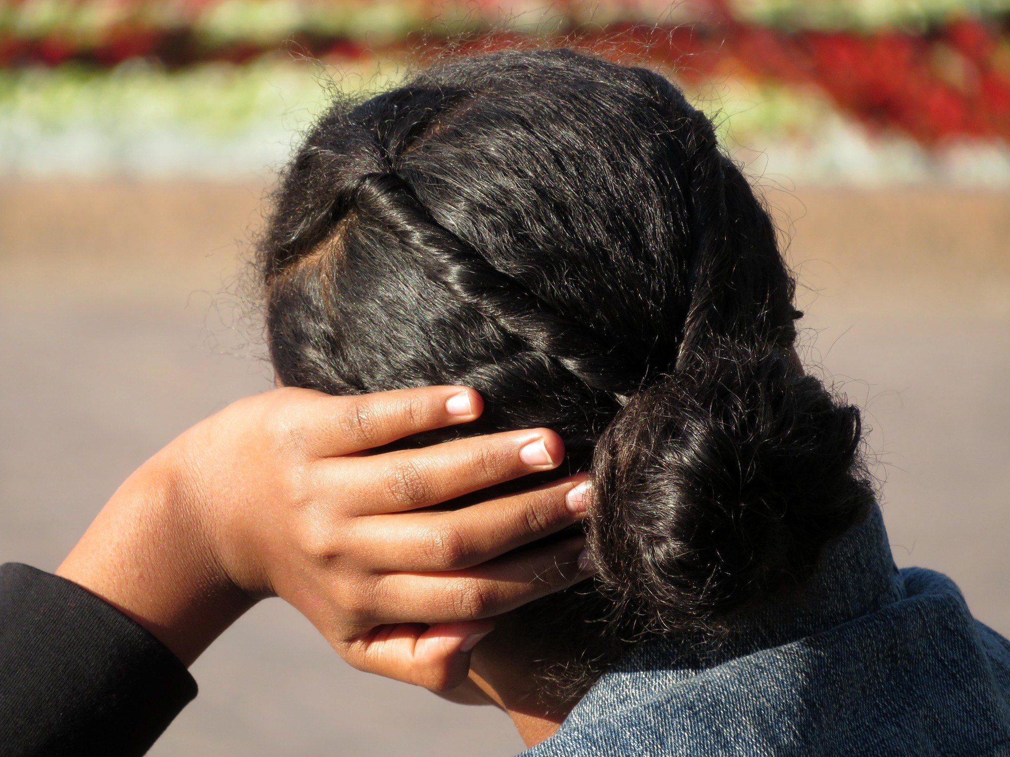 Woman with double twists and a low bun hairdo