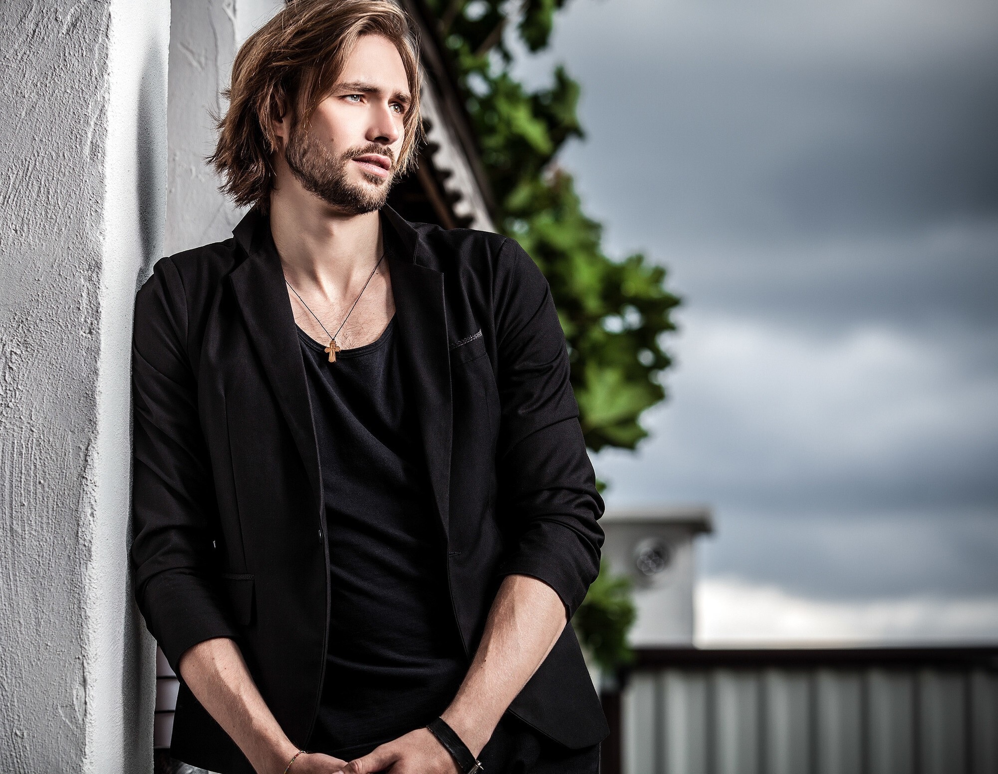 man with medium-length, slightly wavy hair