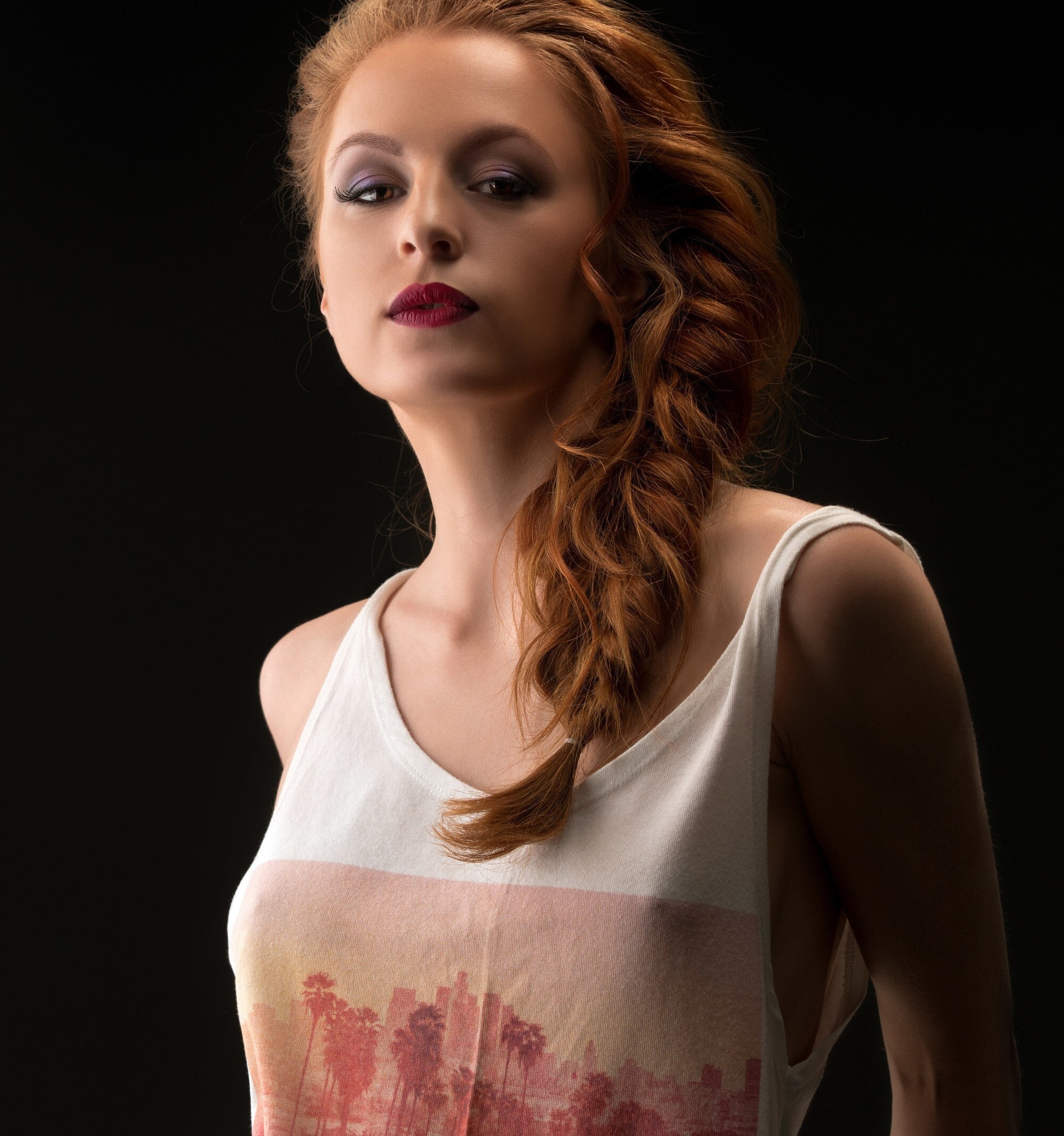 woman with messy fishtail braid hairstyle