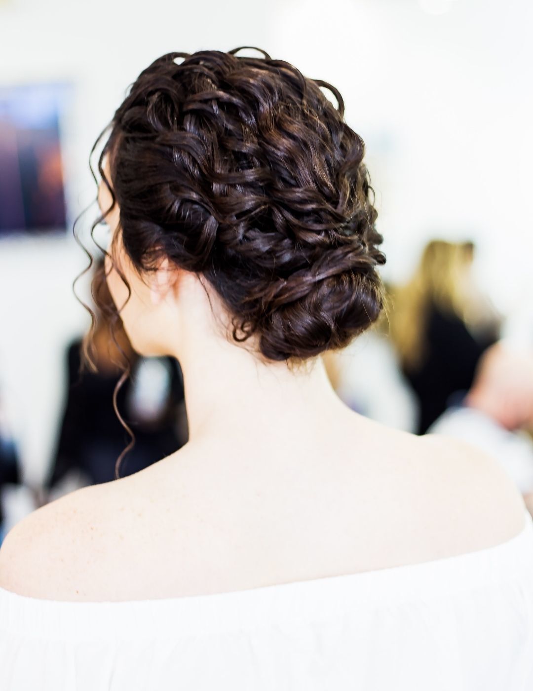 woman with messy updo hairstyle