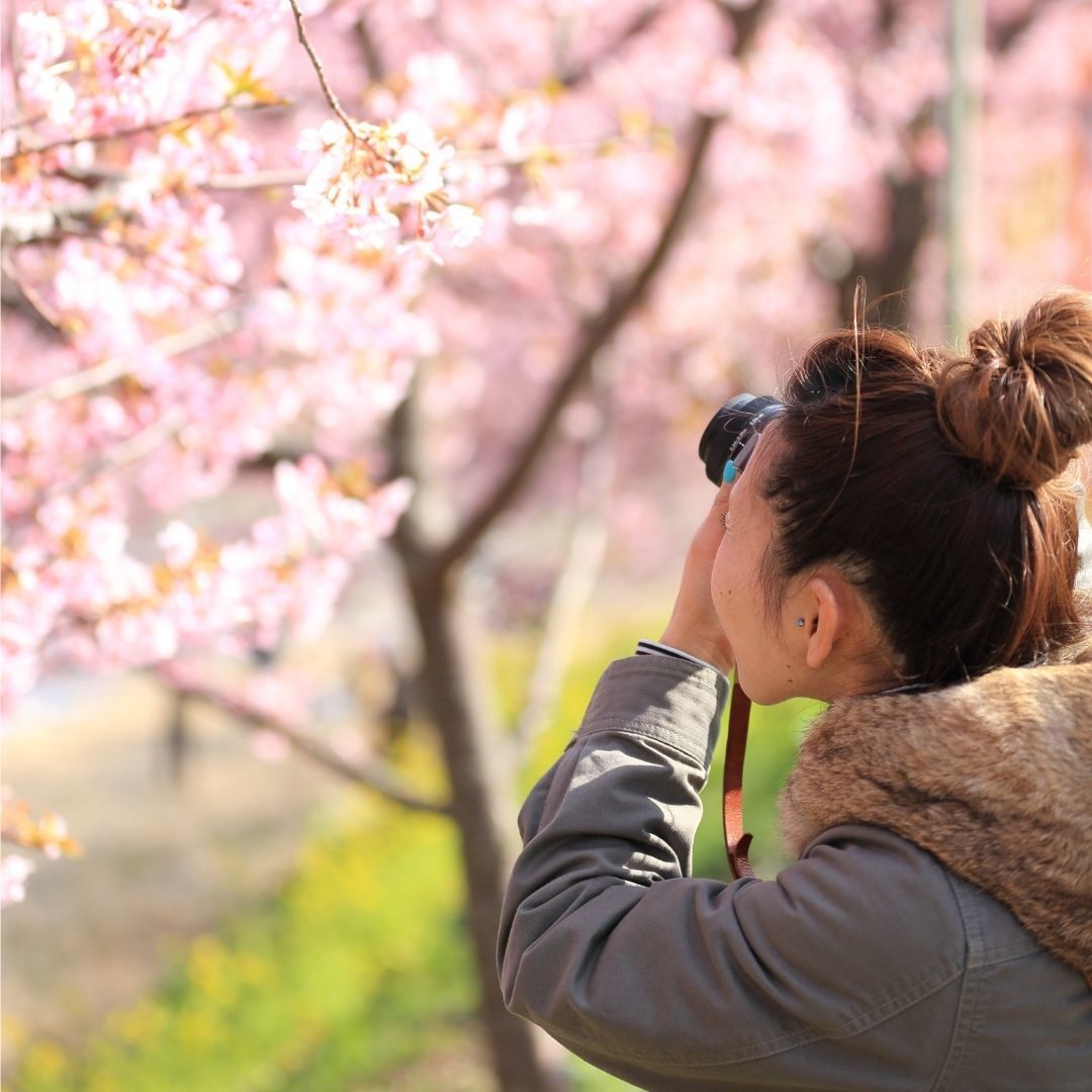 woman with messy topknot hairstyle