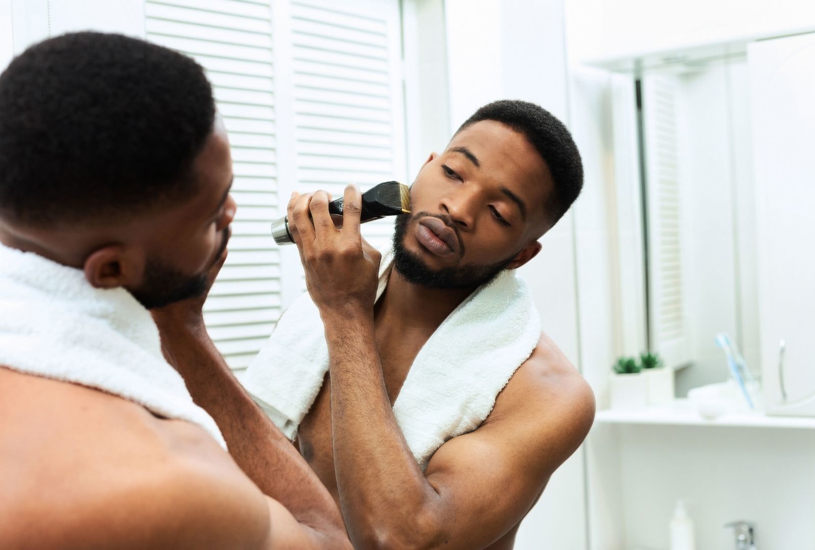 movember: man neatening his beard
