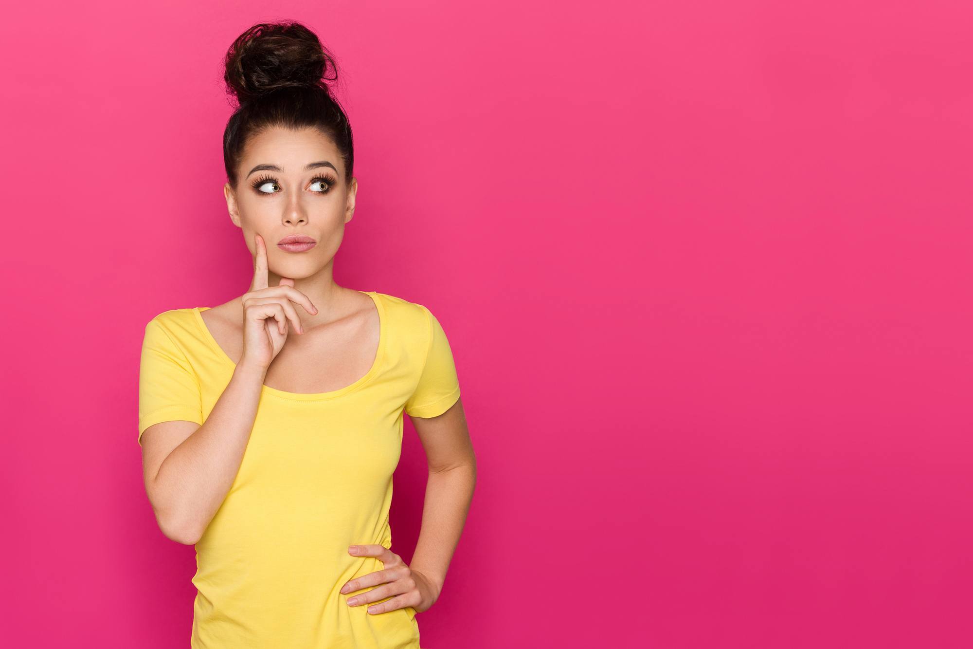beach-lovers hairstyle: woman wearing a top knot