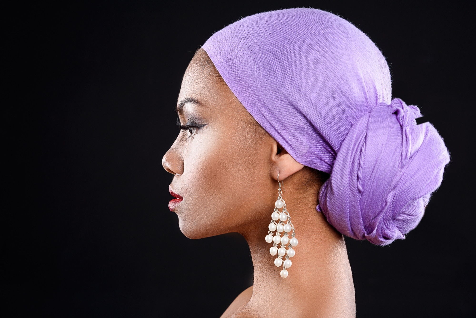 headscarf: woman wearing a side bun headscarf style