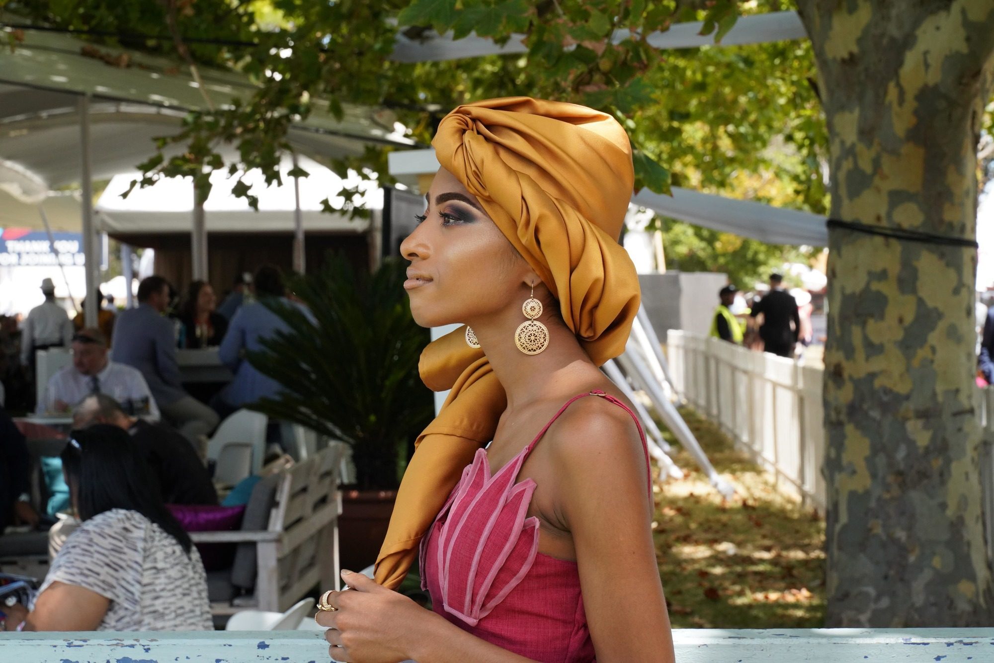 woman with neutral toned satin headwrap
