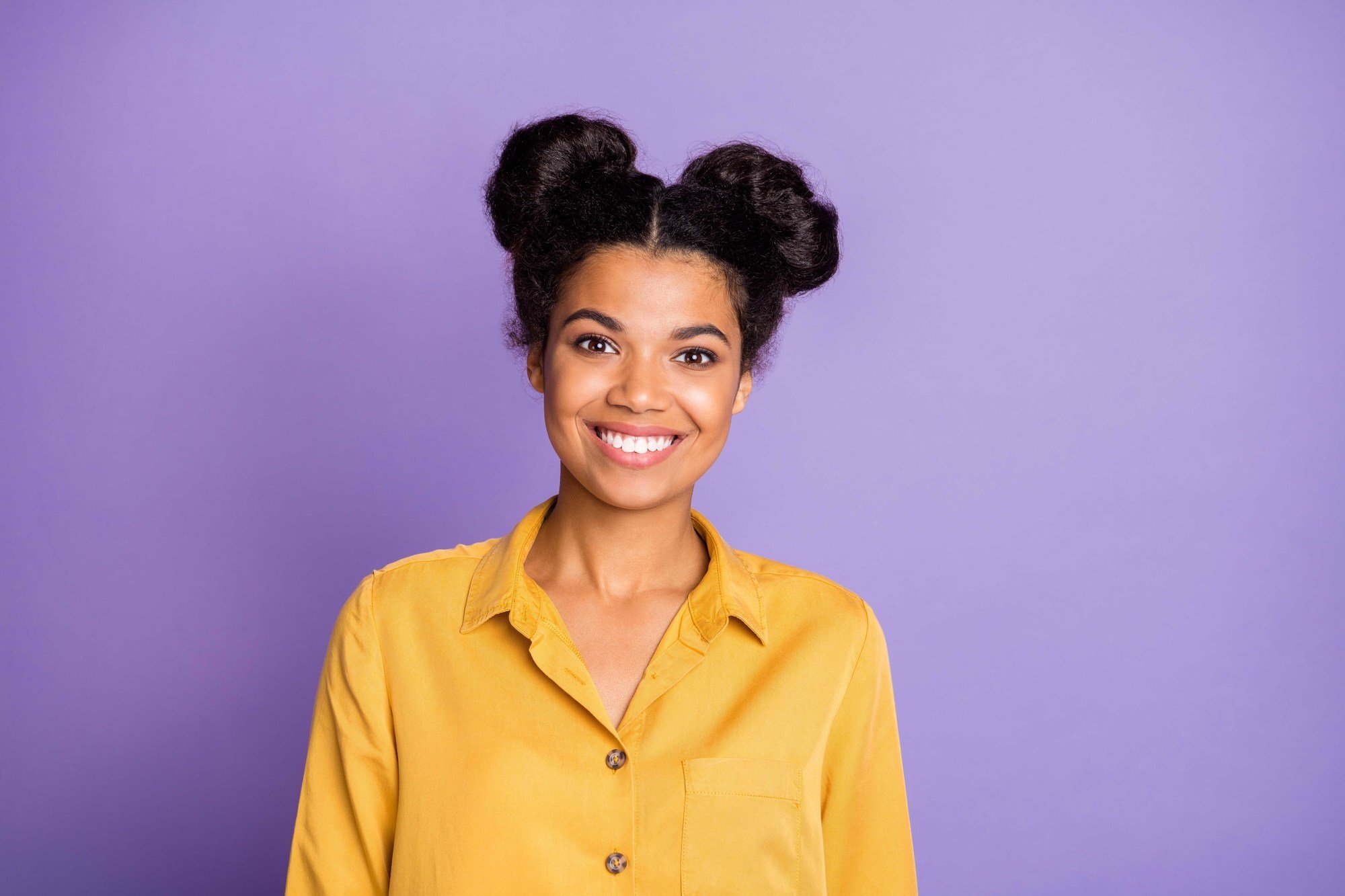 cute styles: woman with space buns hairstyle