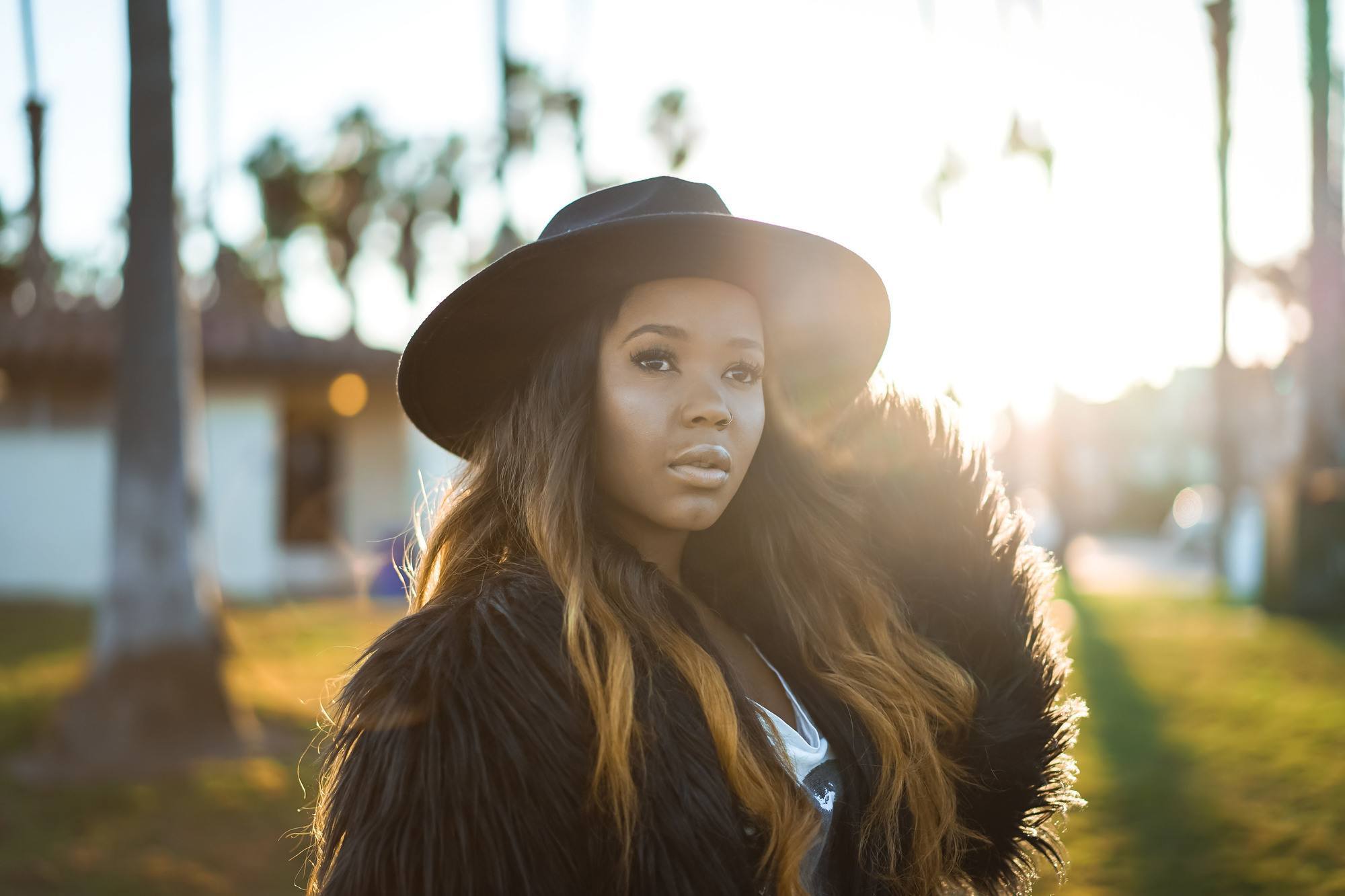 woman wearing a hat for windy weather