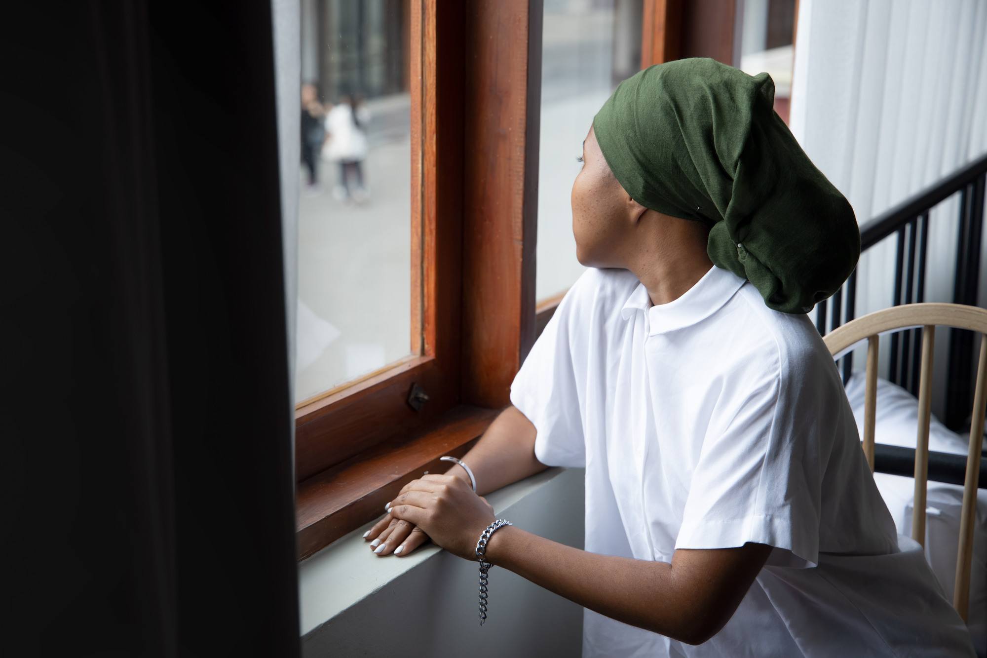 woman wearing a green headscarf