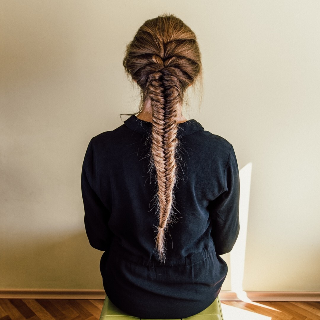 yoga hairstyles woman with a long fishtail braid ombre hair