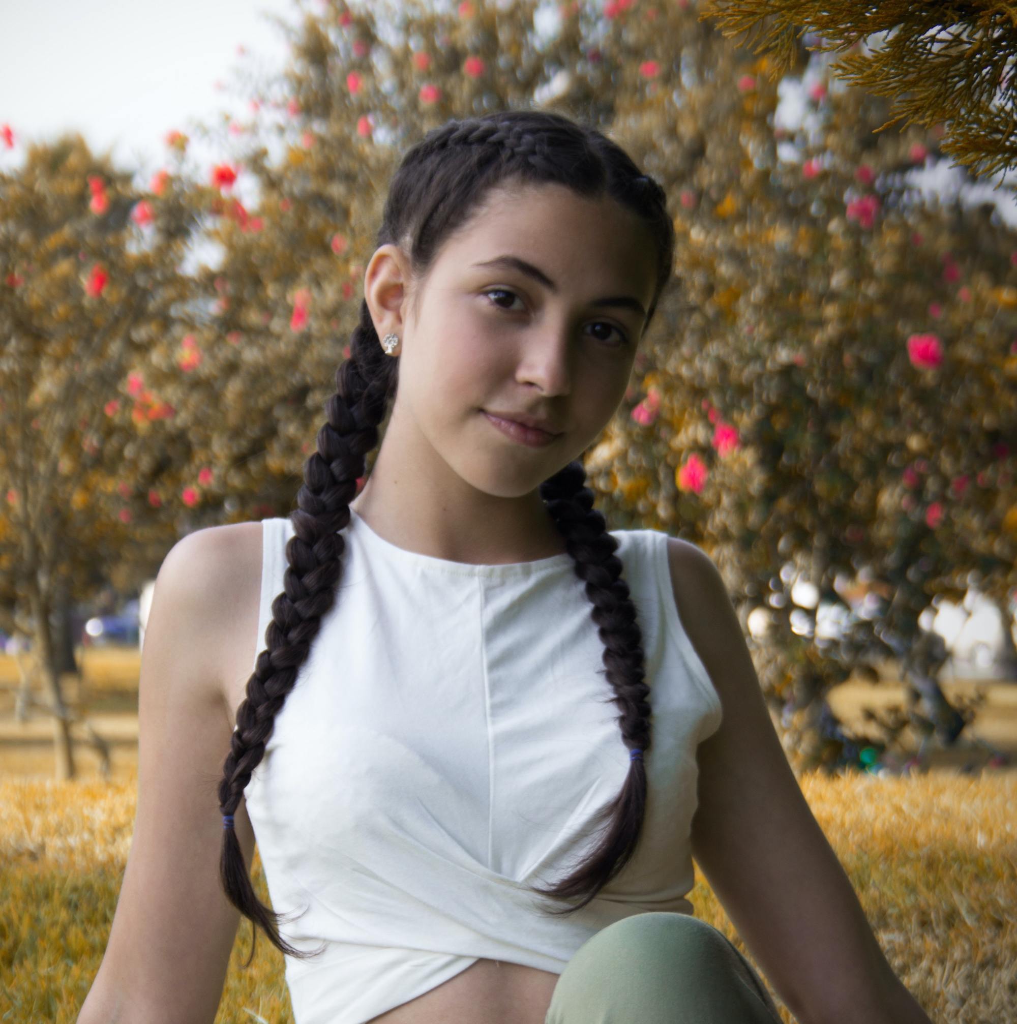 woman with yoga clothes and a double dutch braid hairstyle
