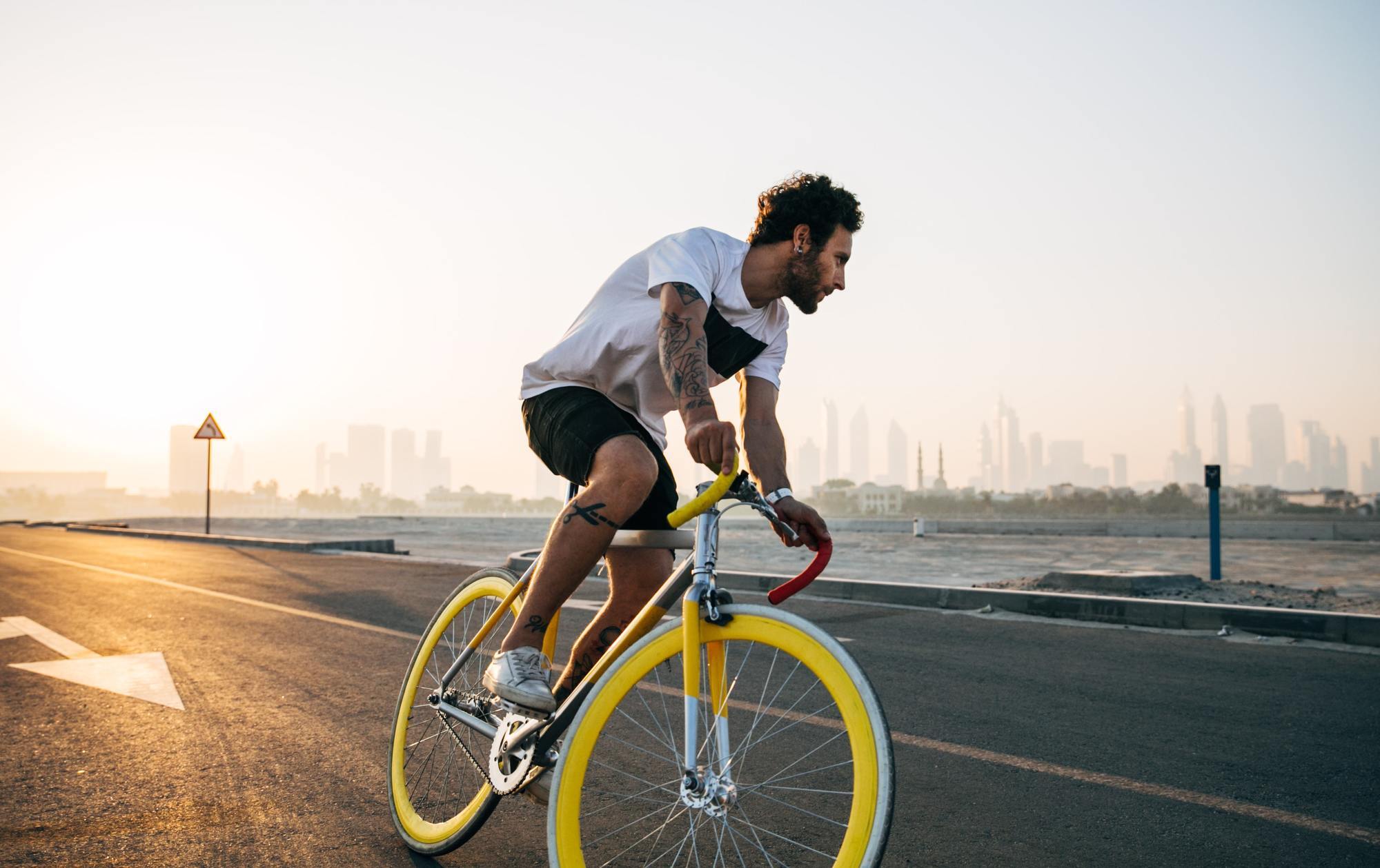 workout hairstyle: image of a man with short hair, riding a mountain bike
