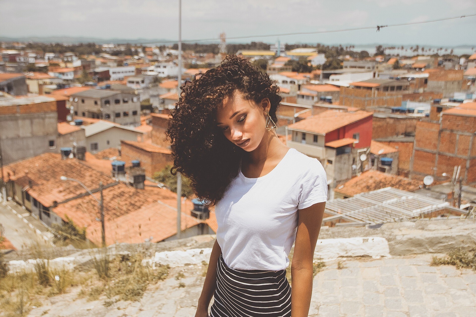 woman with healthy brown curly hair
