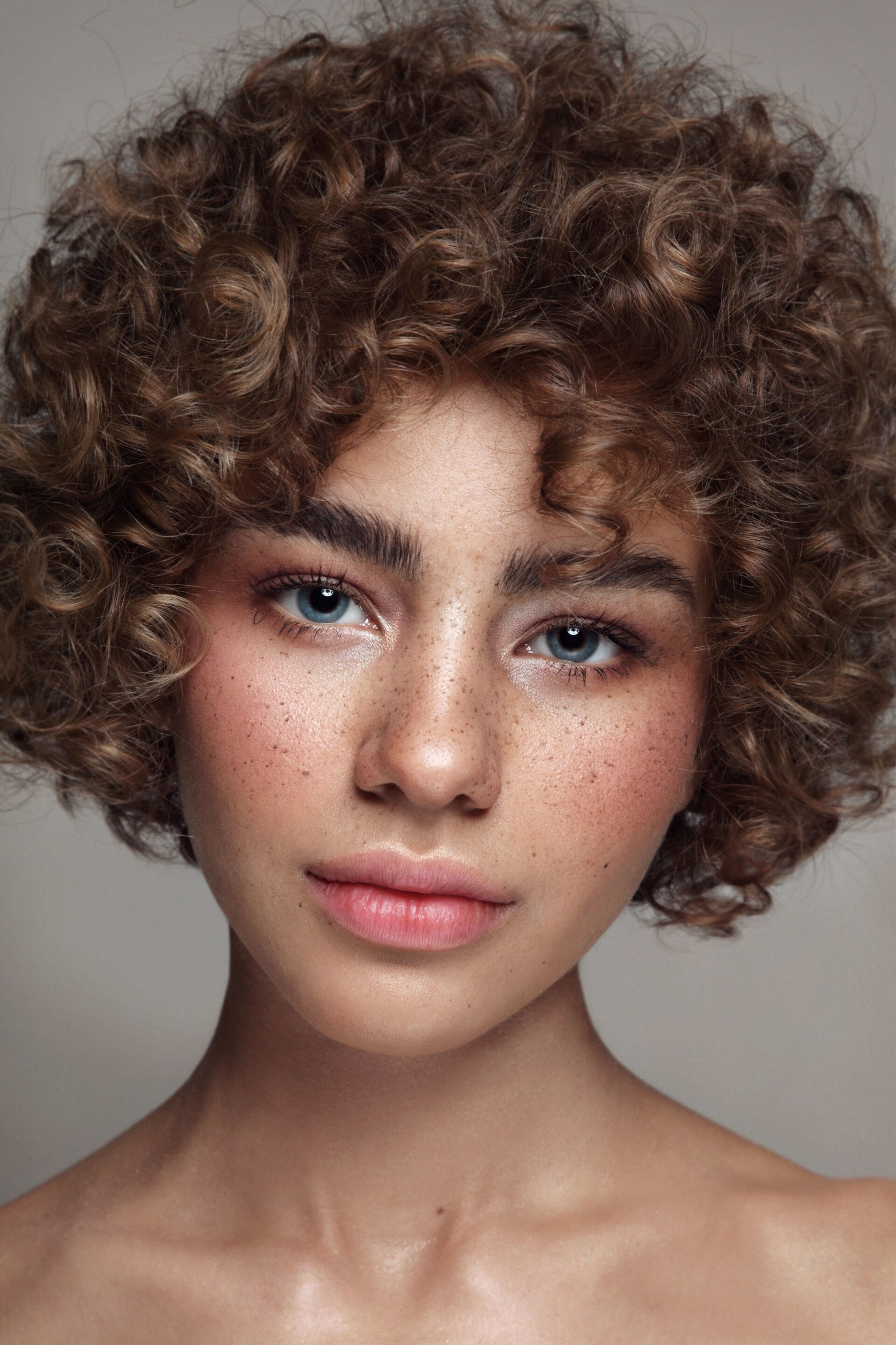 Woman with short tight curls