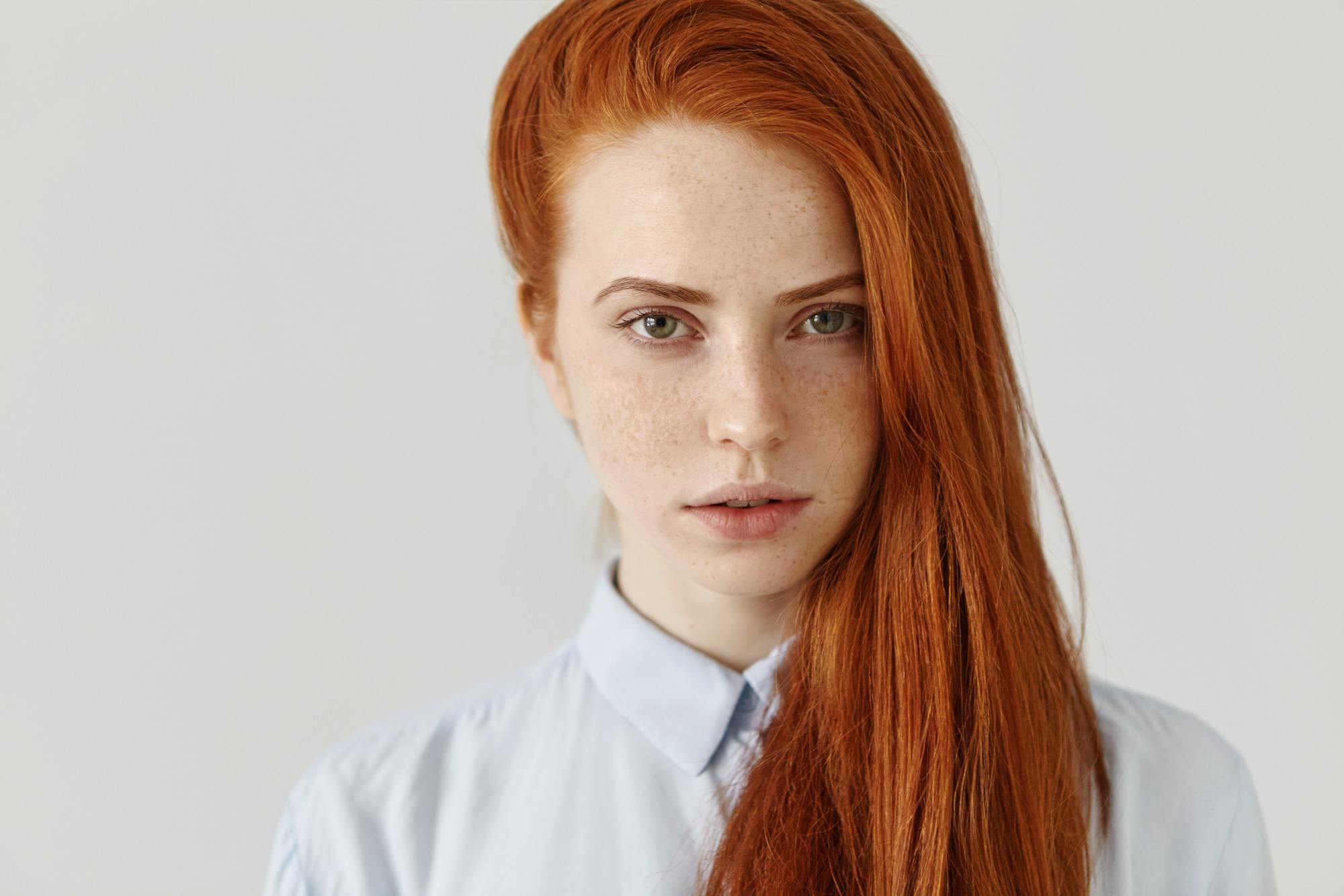 growing out an undercut: woman with long red hair