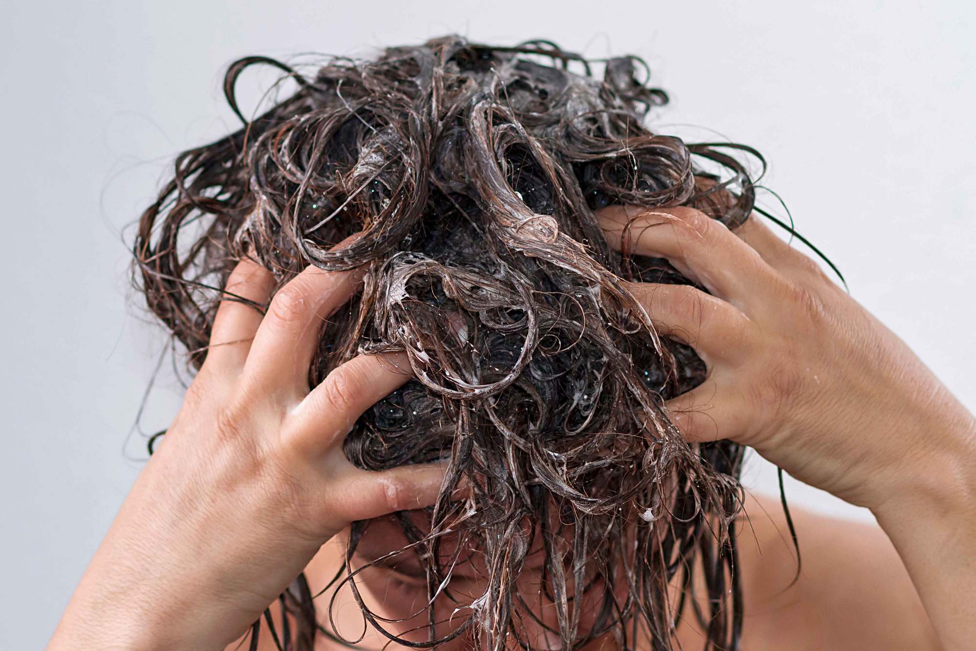 woman co-washing her hair