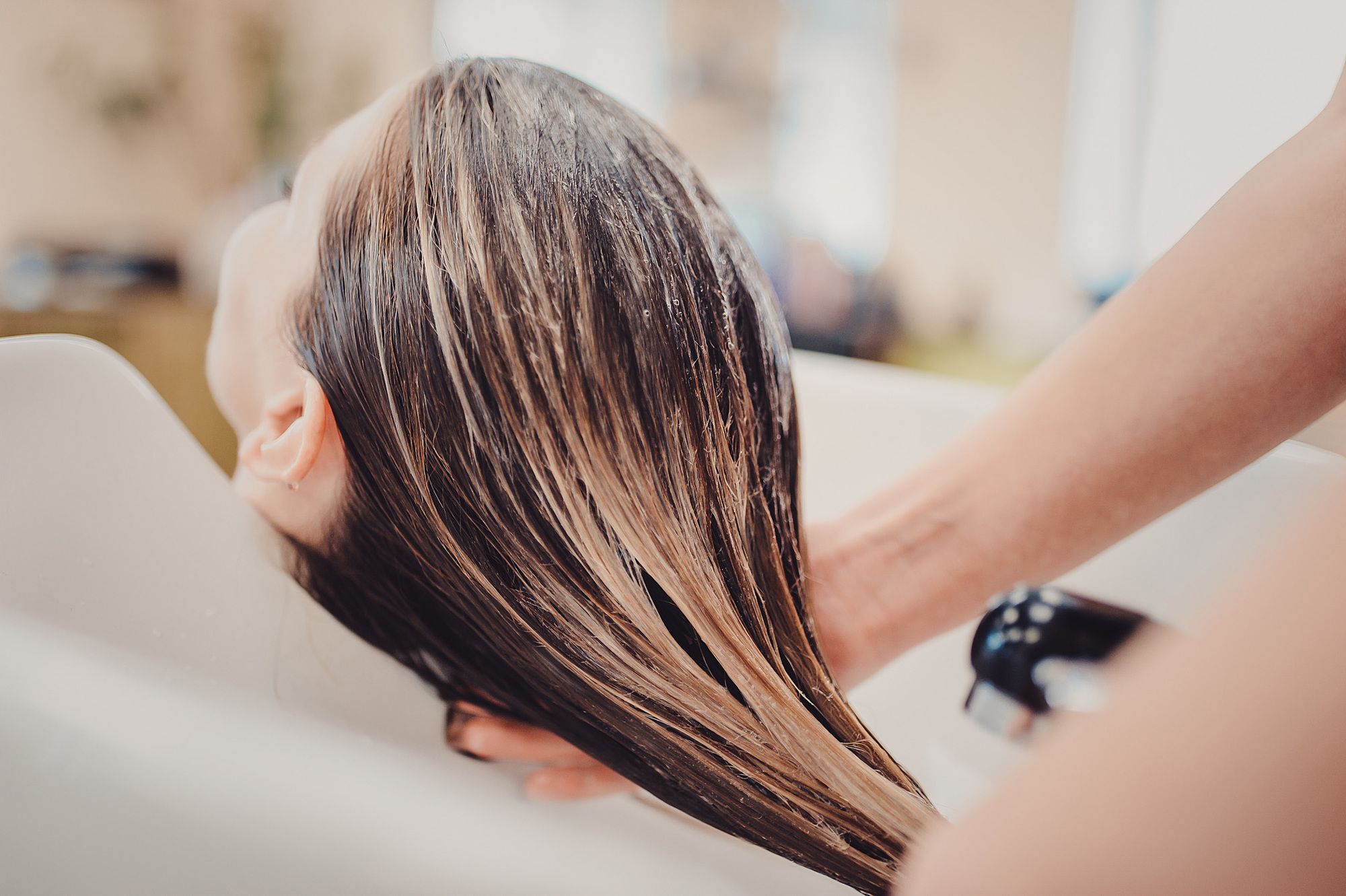 Woman having hair washed