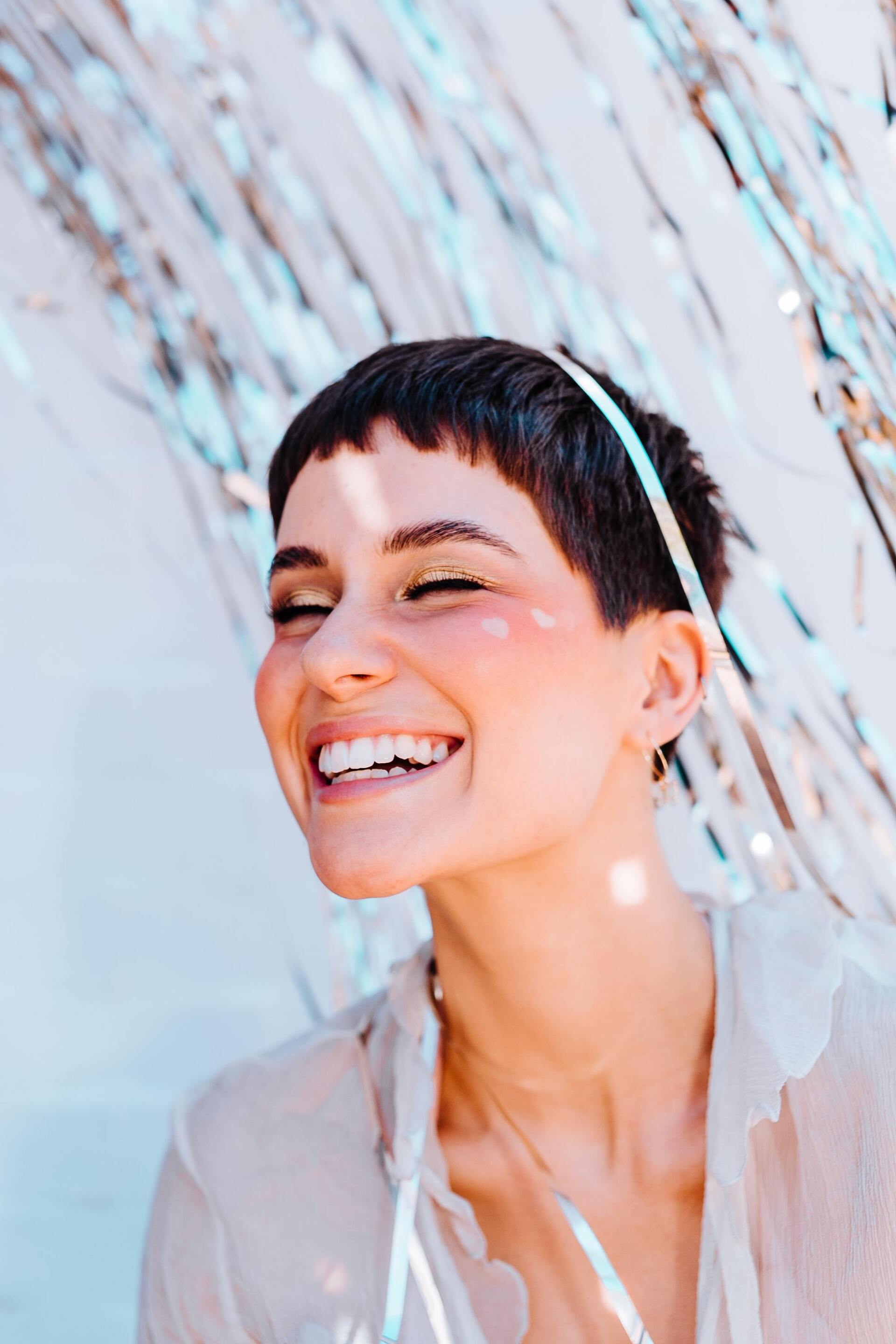 Woman with short festive pixie haircut