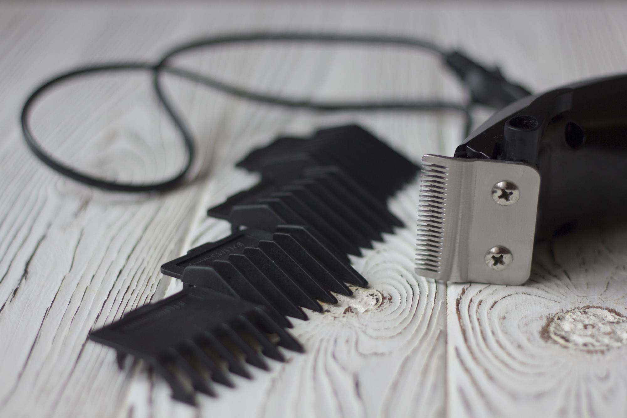 close-up shot of hair clippers and clipper guards