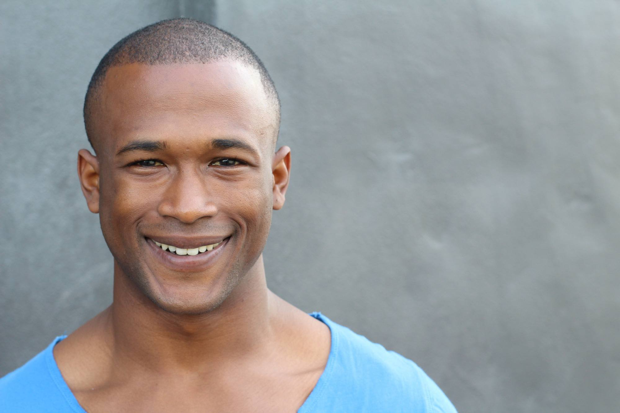 man with very short, shaved hair